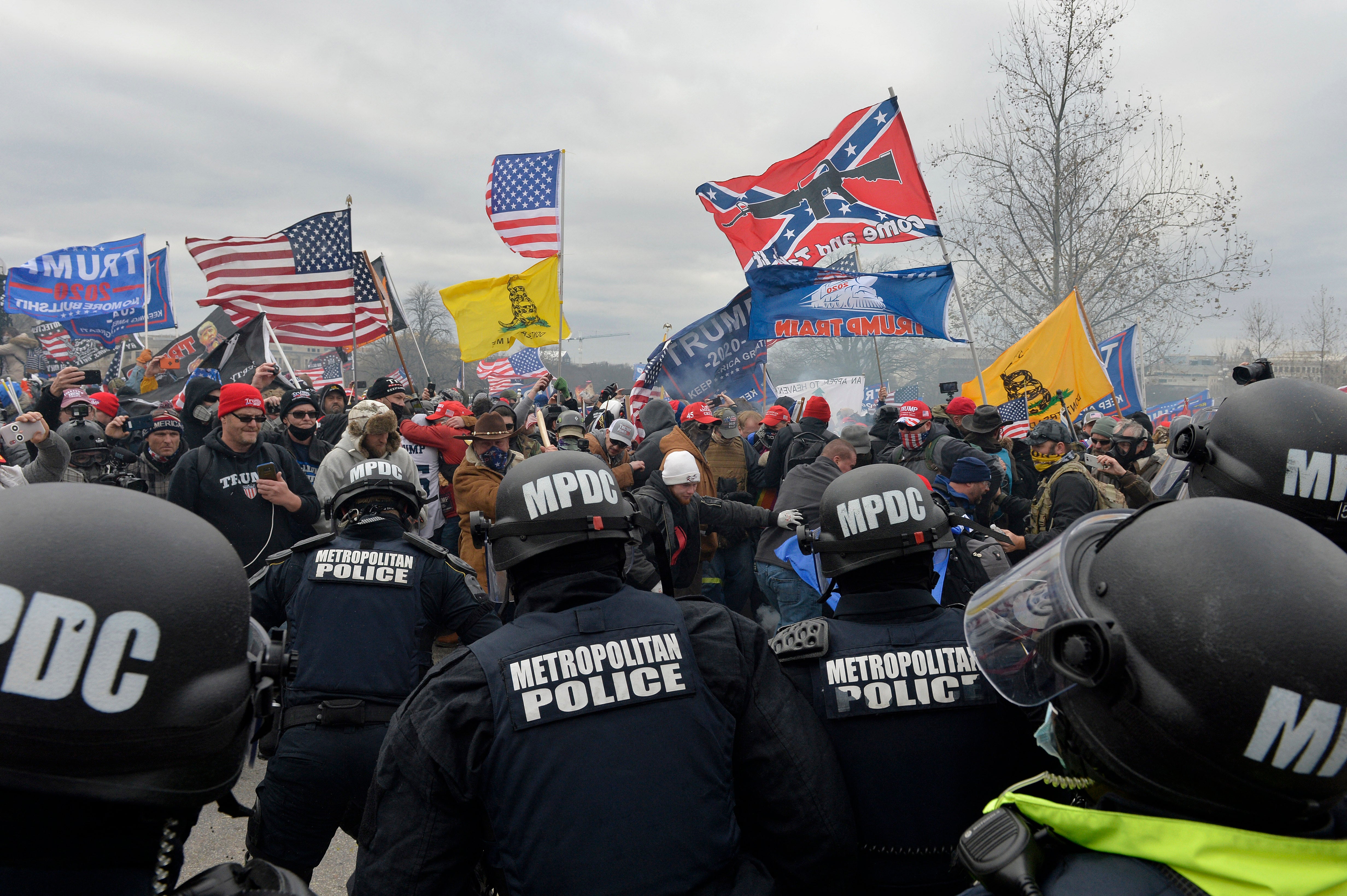 Demonstrators breeched security and entered the Capitol as Congress debated the a 2020 presidential election Electoral Vote Certification