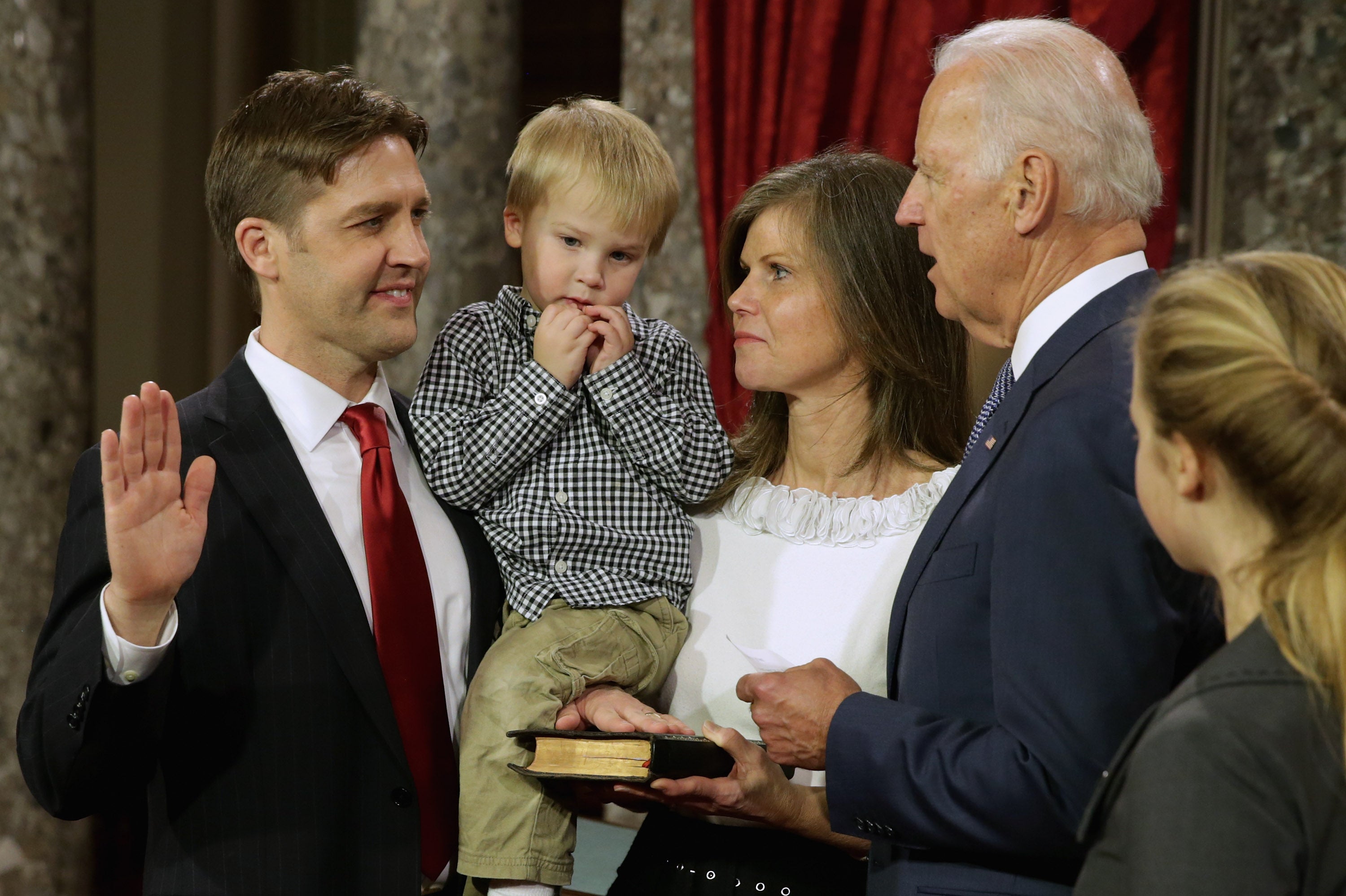 Former Sen. Ben Sasse seen with his family in 2015 as he was ceremonially sworn in by U.S. Vice President Joe Biden