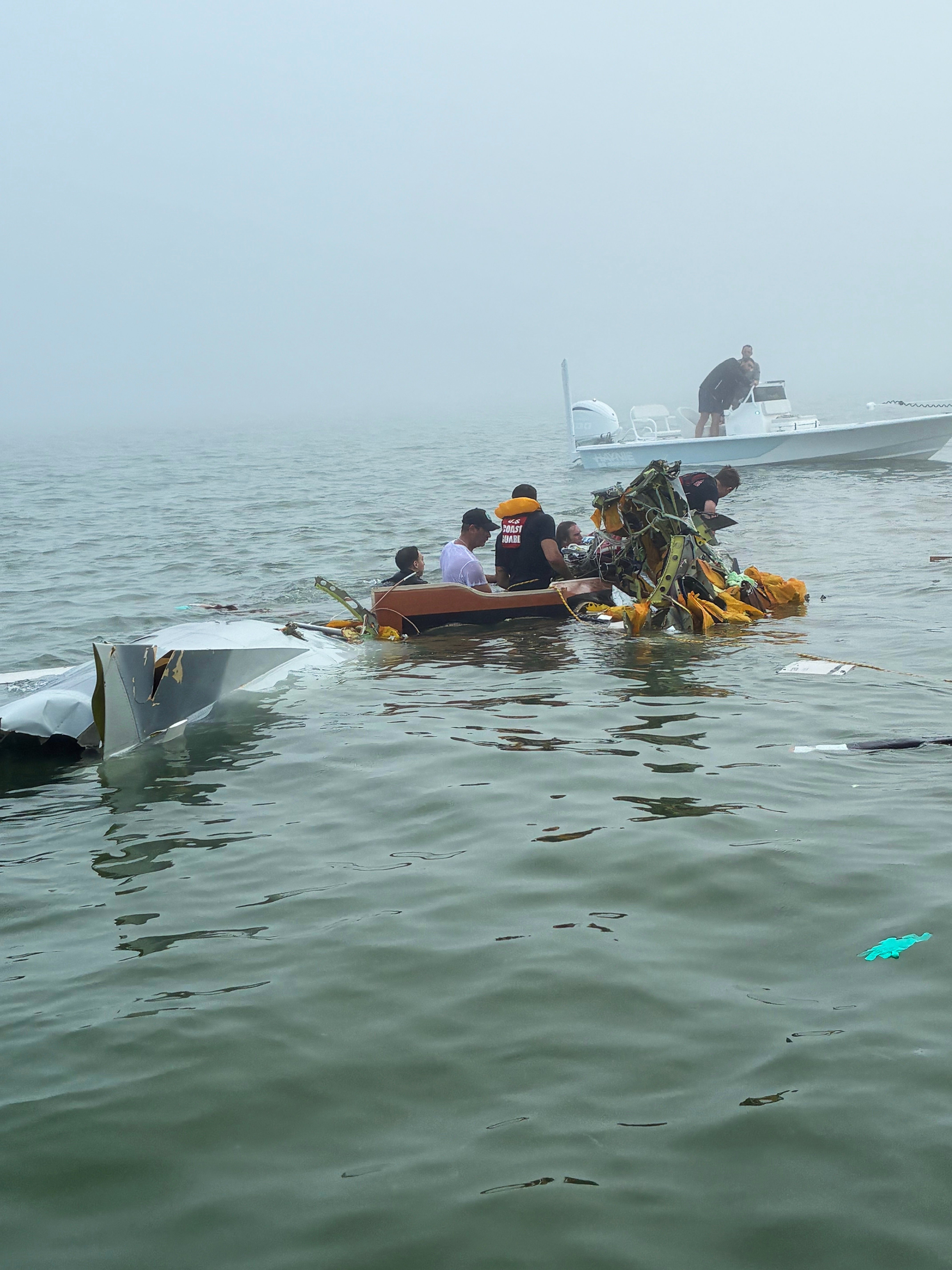 In this image provided by Sky Decker Jr., authorities and volunteers respond to a Mexican Navy plane crash near Galveston, Texas, Monday, Dec. 22, 2025. (Sky Decker Jr. via AP)
