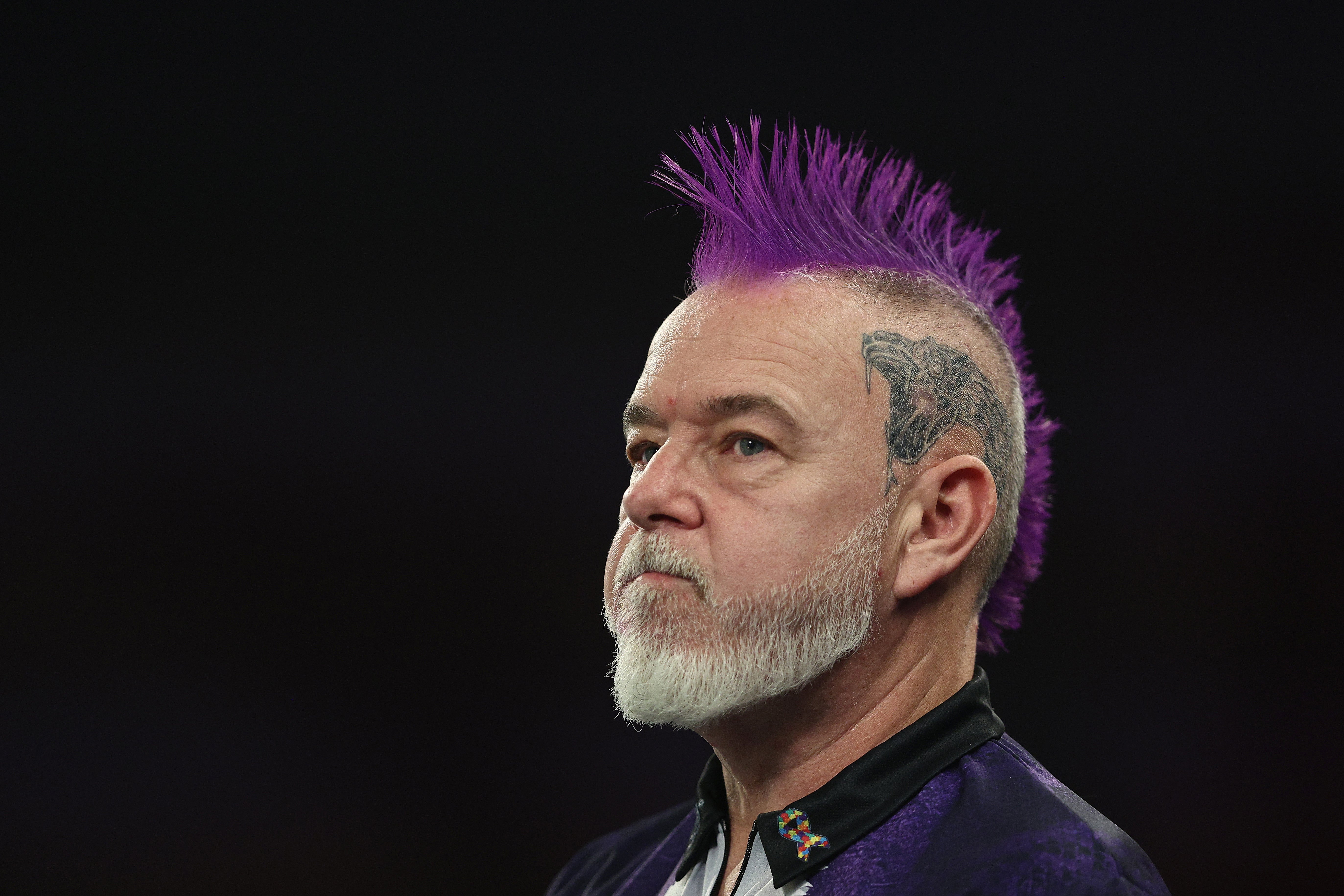 Peter Wright of Scotland looks on against Arno Merk of Germany