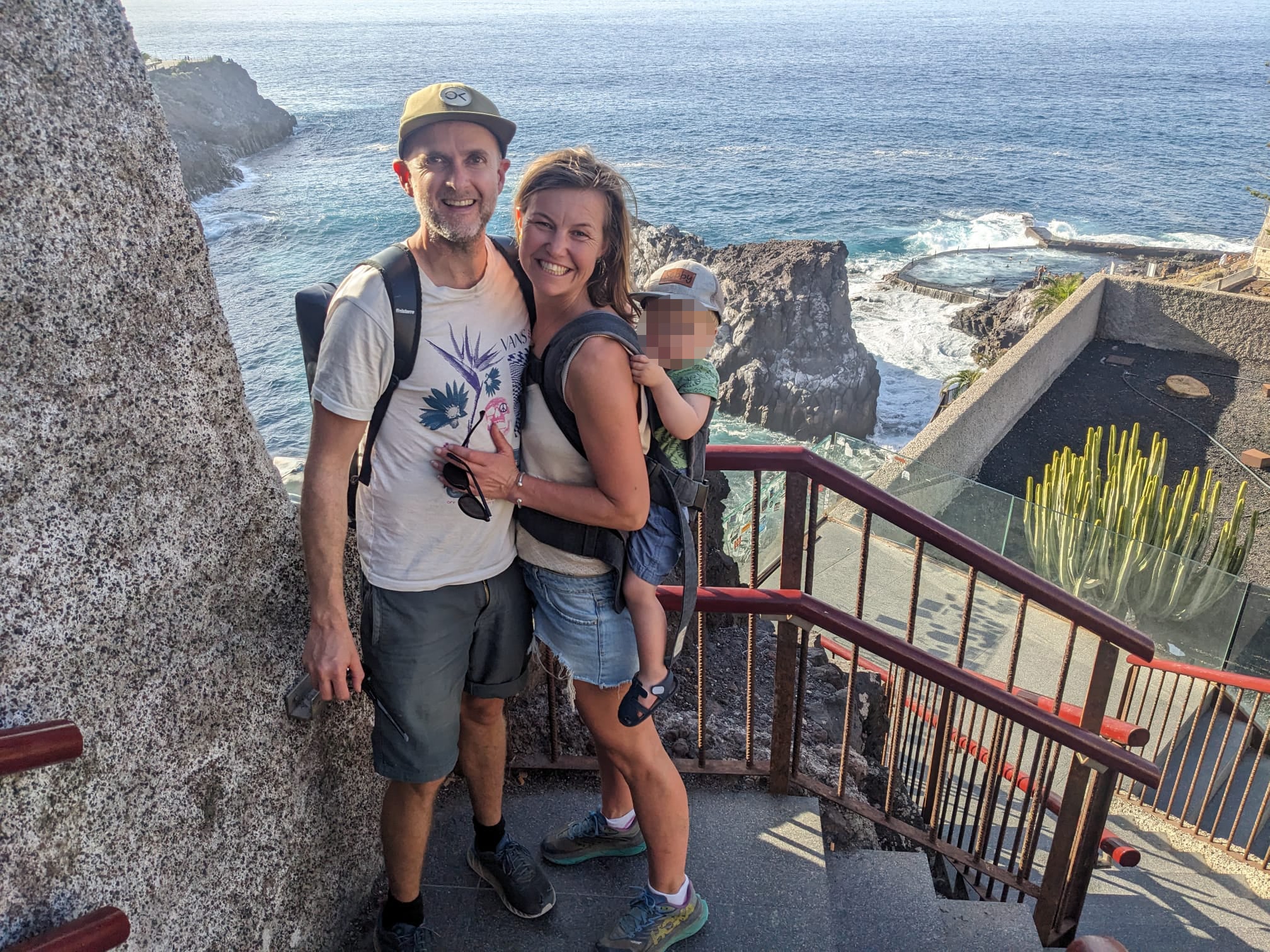 Kai Barrington with Sarah Jellard from Braunton and their 20-month-old baby (name not given) near the natural pool in Los Gigantes