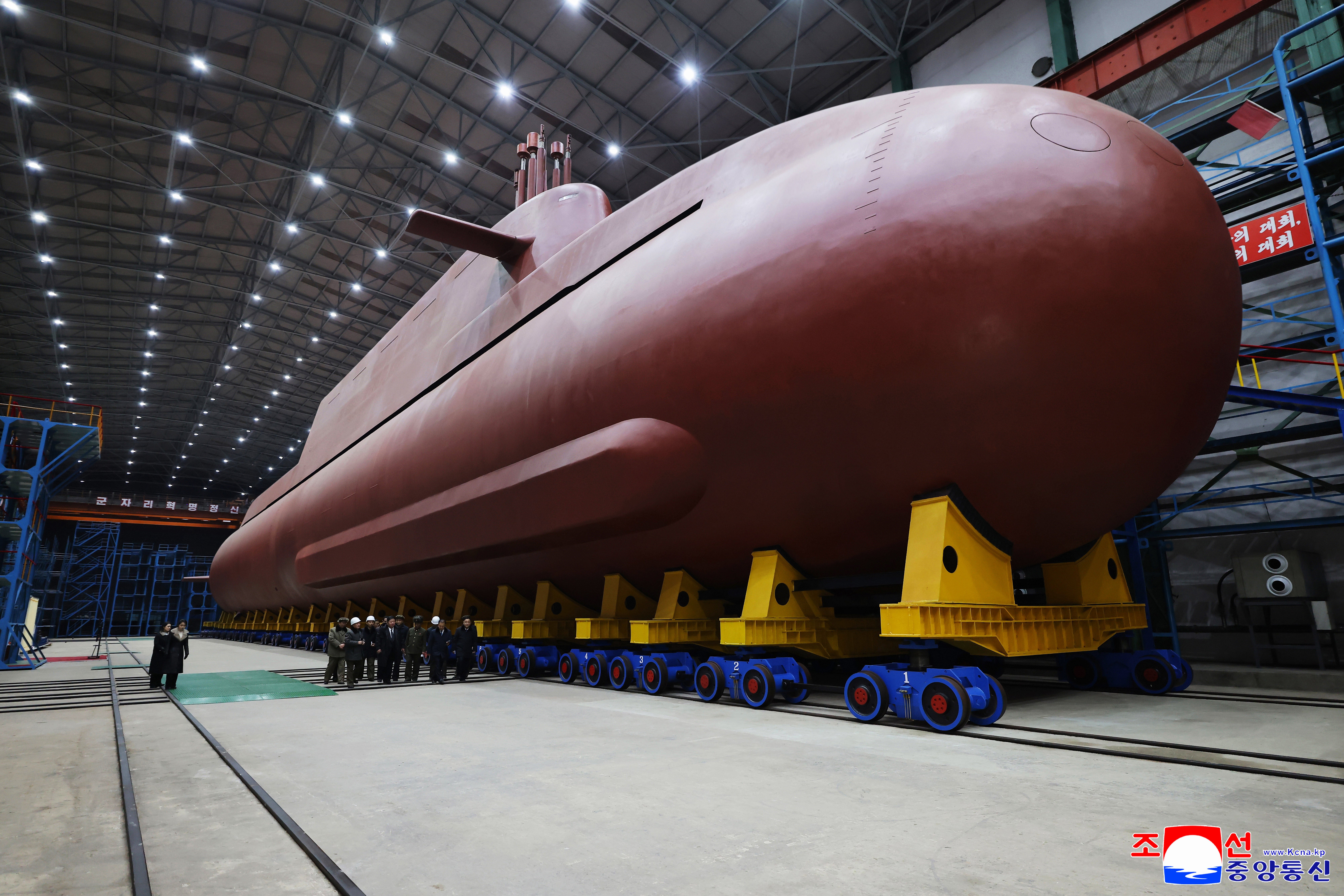 <p>Kim Jong Un inspects a submarine under construction at an undisclosed location in North Korea</p>