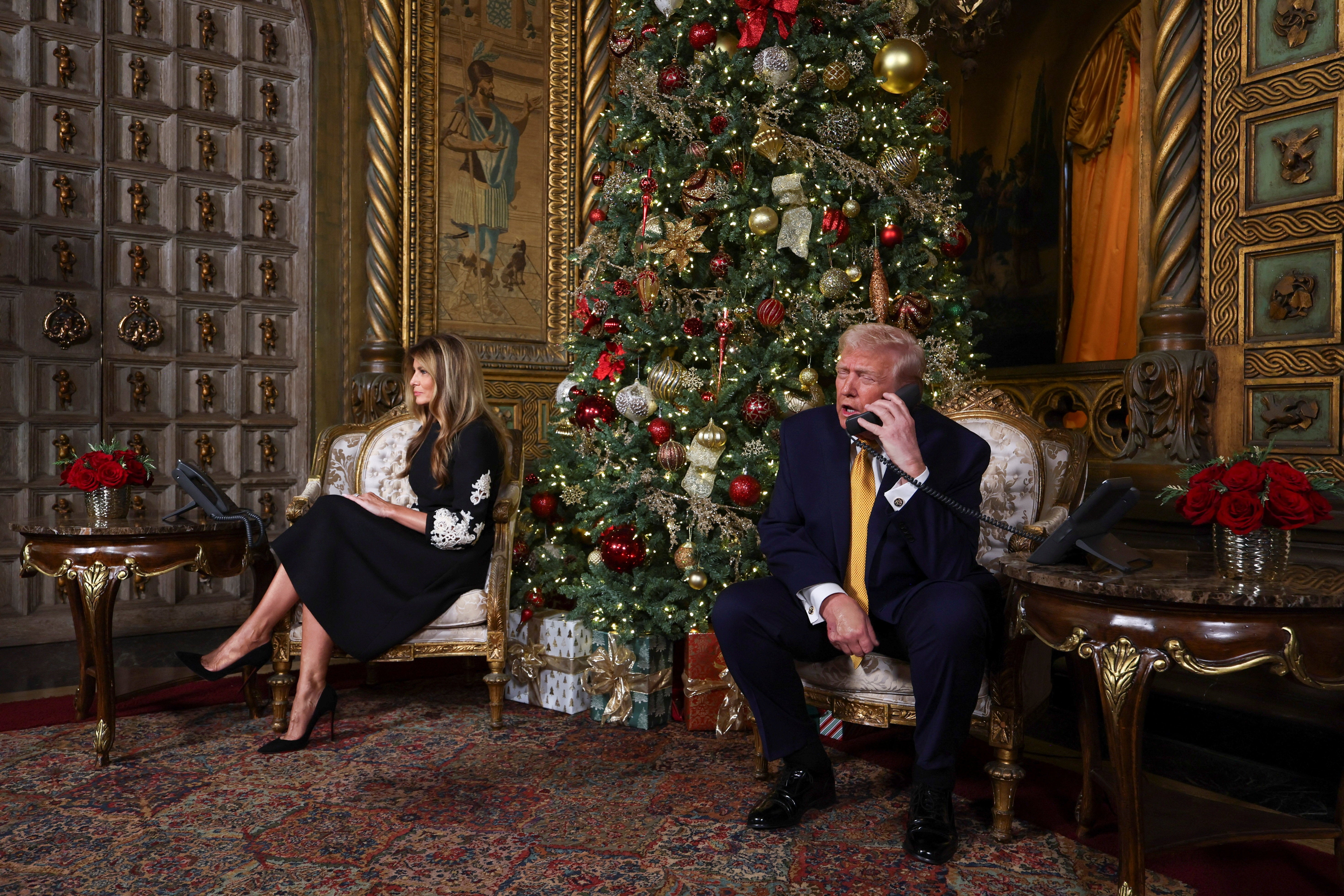 President Donald Trump and first lady Melania Trump participate in NORAD Santa tracker phone calls, on Christmas Eve, from the Mar-a-lago club in Palm Beach, Florida