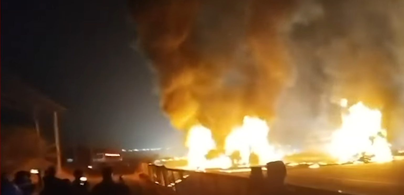 Screengrab. Flames leap from a bus following a collision with a truck in Karnataka, India