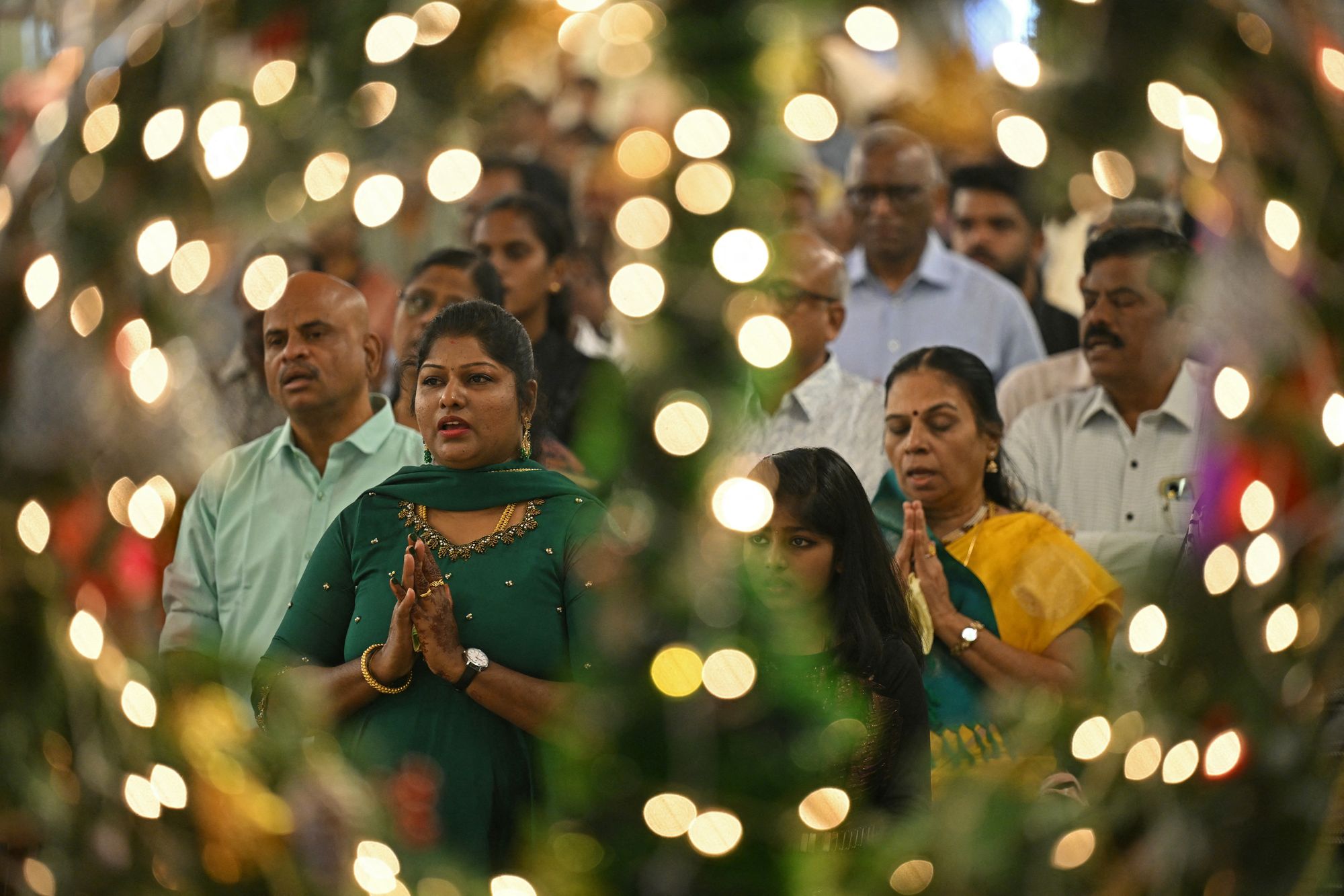 Devotees attend the Christmas mass in the Santhome Cathedral Basilica church in Chennai, India