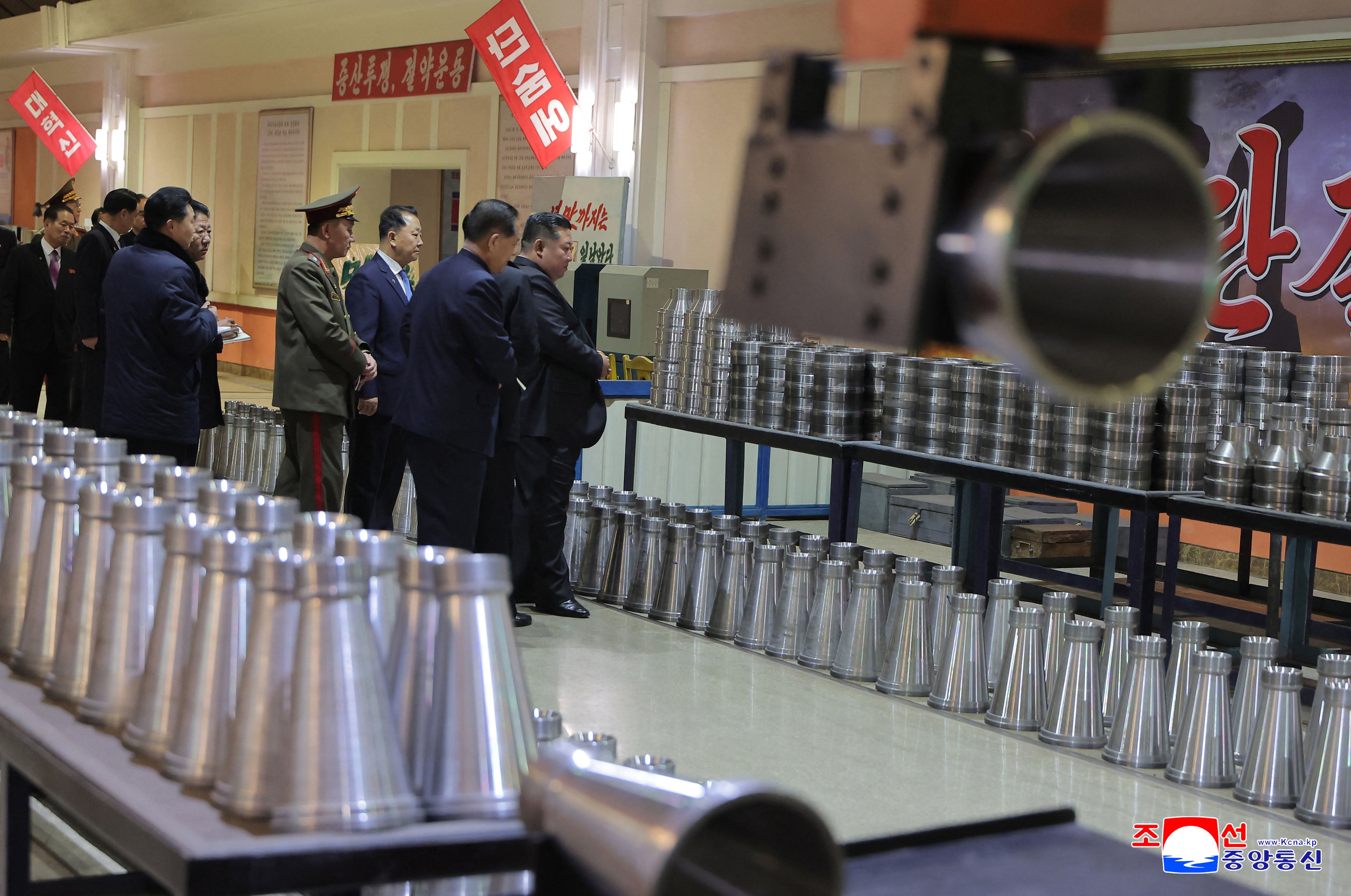 Kim Jong Un visits a munitions plant at an undisclosed location in North Korea.