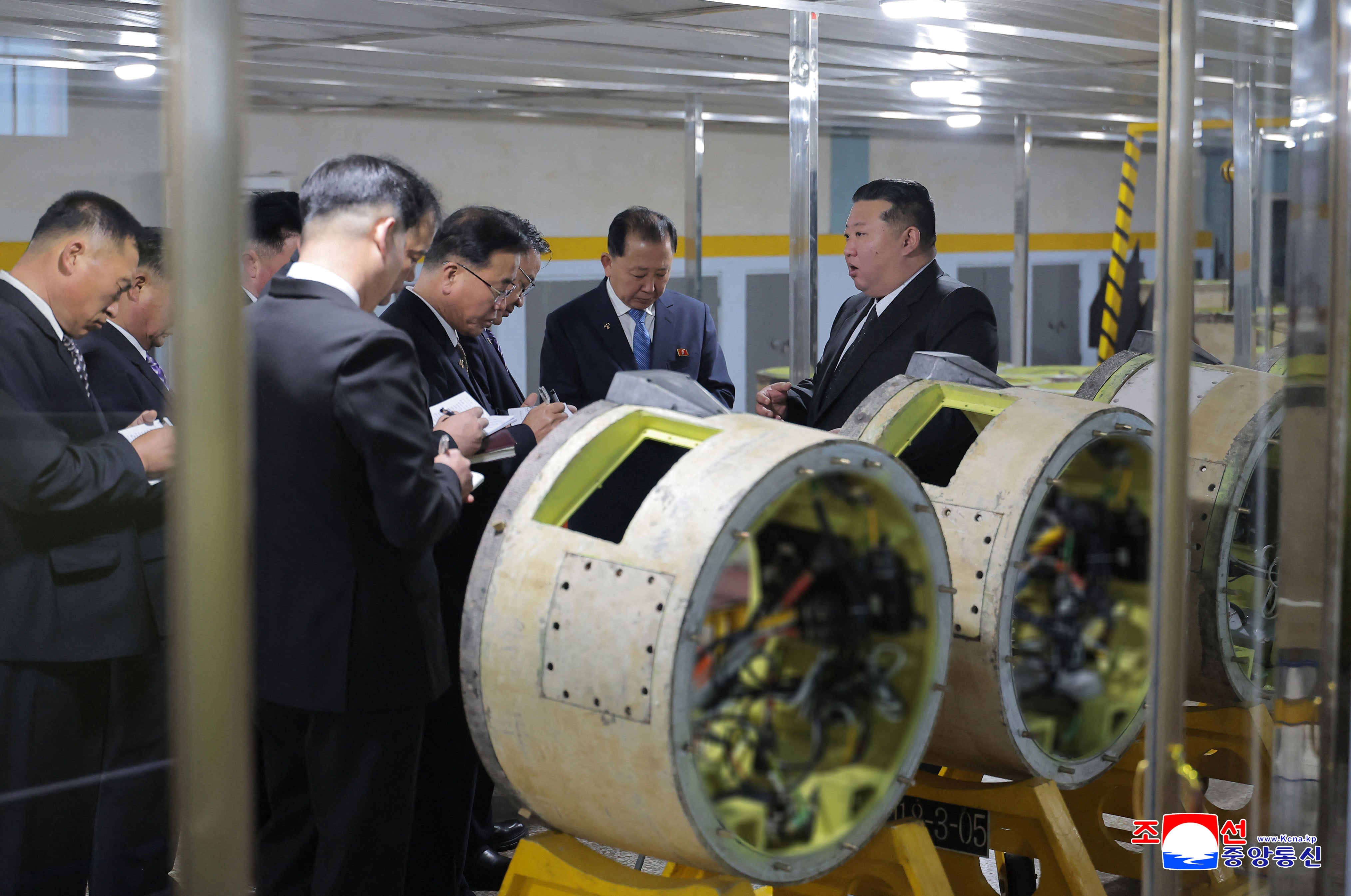 Kim Jong Un visits a munitions factory at an undisclosed place in North Korea