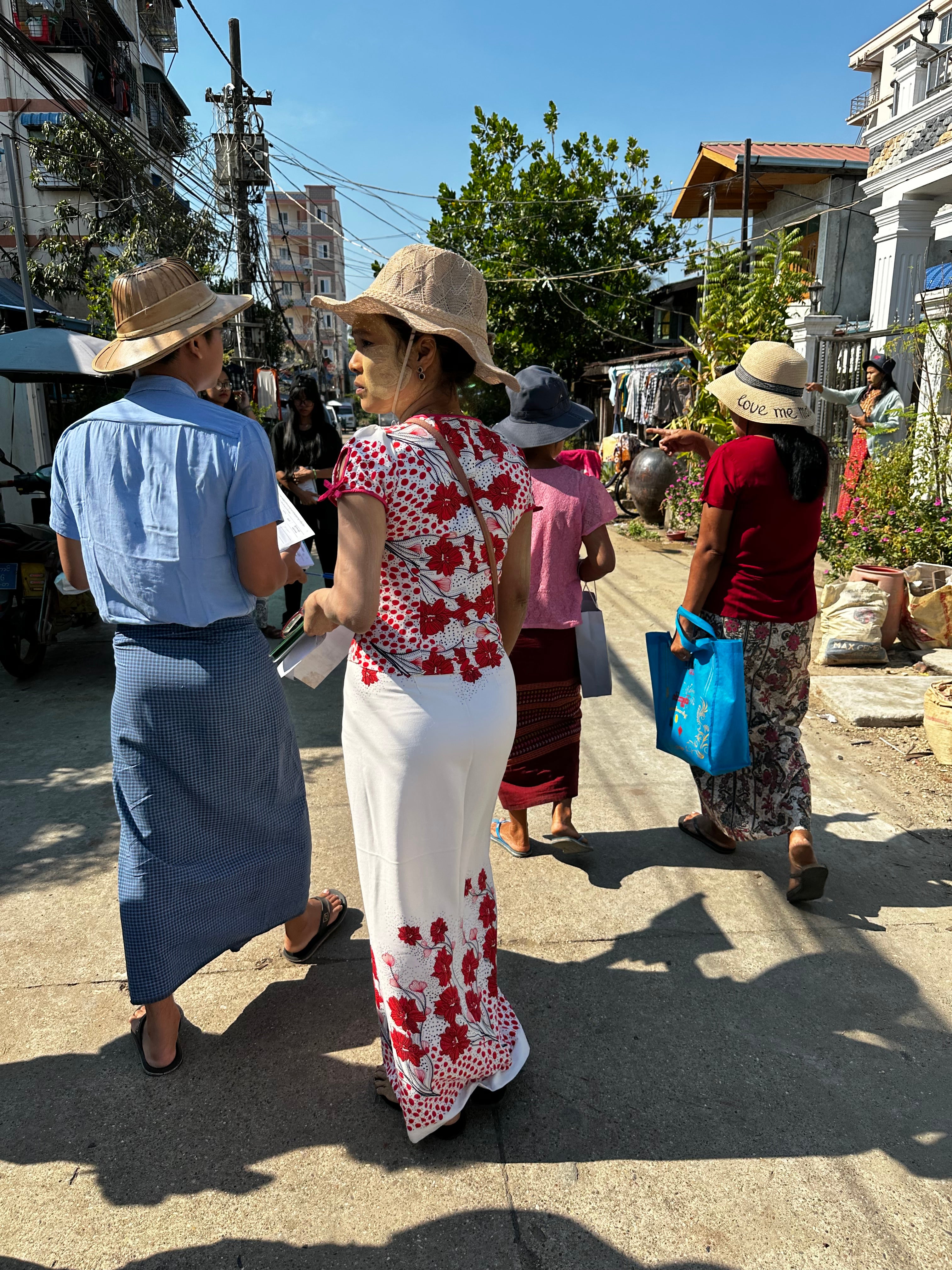 Volunteers with the junta-backed USDP party out campaigning in Thaketa township, Yangon on Friday morning