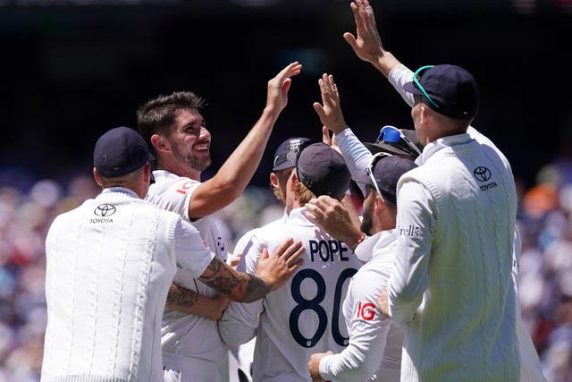 England�s Josh Tongue (left) celebrates with teammates after taking the wicket of Australia’s Usman Khawaja (Robbie Stephenson/PA)