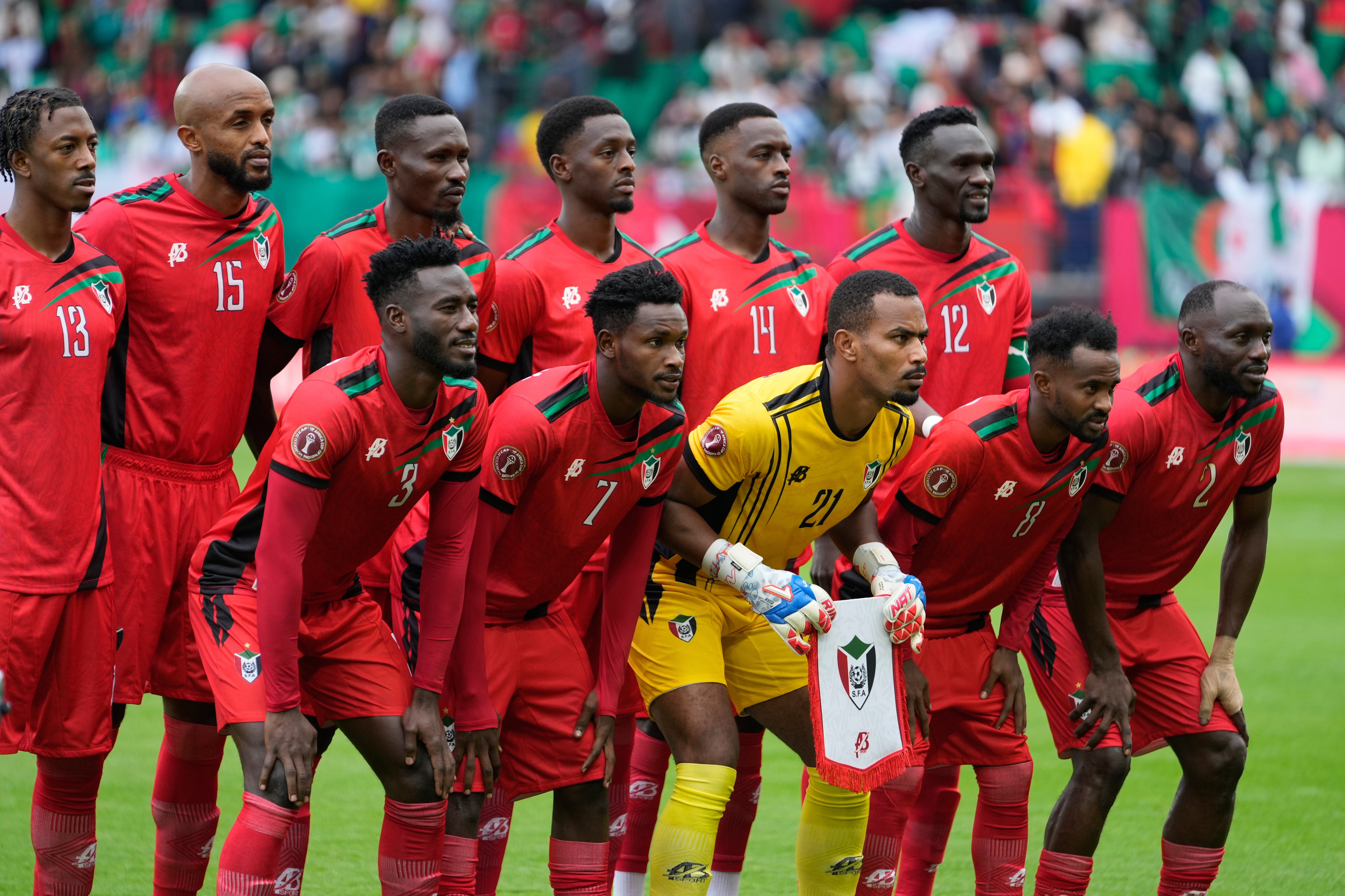 Sudan's players pose for the team picture before the Africa Cup of Nations group E soccer match between Algeria and Sudan in Rabat, Morocco, Wednesday, Dec. 24, 2025. (AP Photo/Mosa'ab Elshamy)