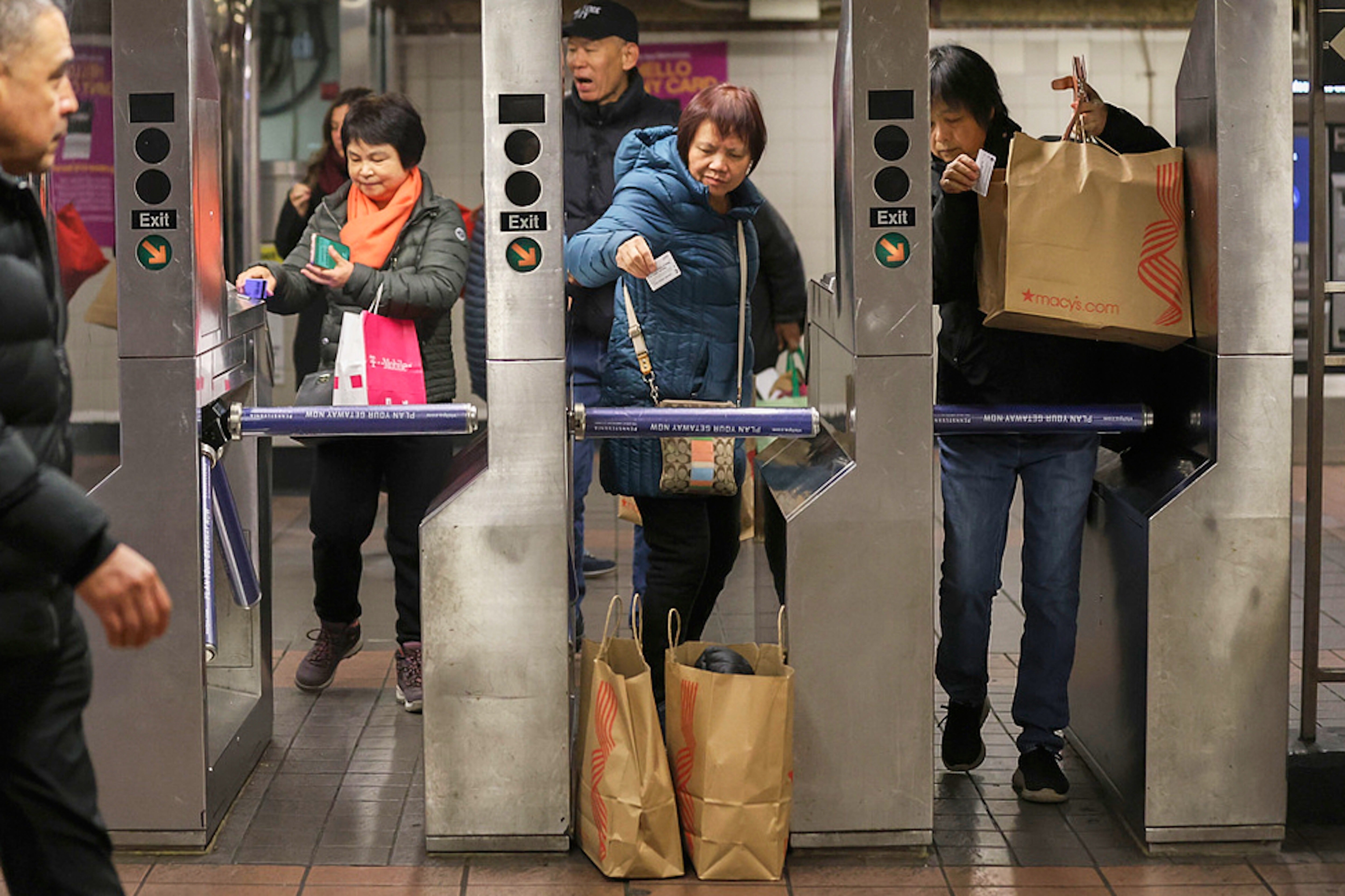 Shoppers swipe their MetroCards as they enter the subway turnstiles, Nov. 29, 2024, in New York. (AP Photo/Heather Khalifa, File)