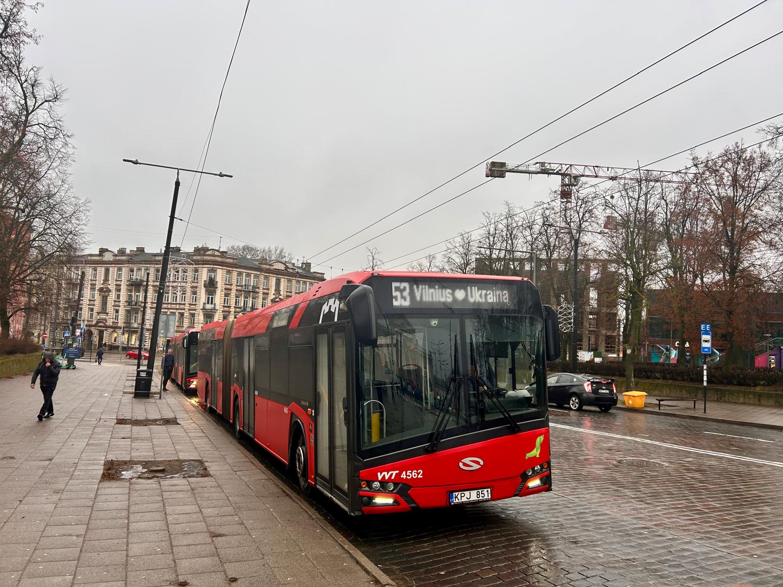 A bus sign reads 'Vilnius loves Ukraina' near Vilnius Central station