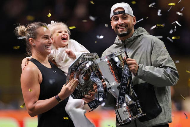 <p>Nick Kyrgios and Aryna Sabalenka celebrate with their trophies at the end of the Battle of the Sexes exhibition</p>