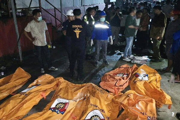 Body bags containing victims of a fire at a retirement home in Manado, North Sulawesi province, Indonesia