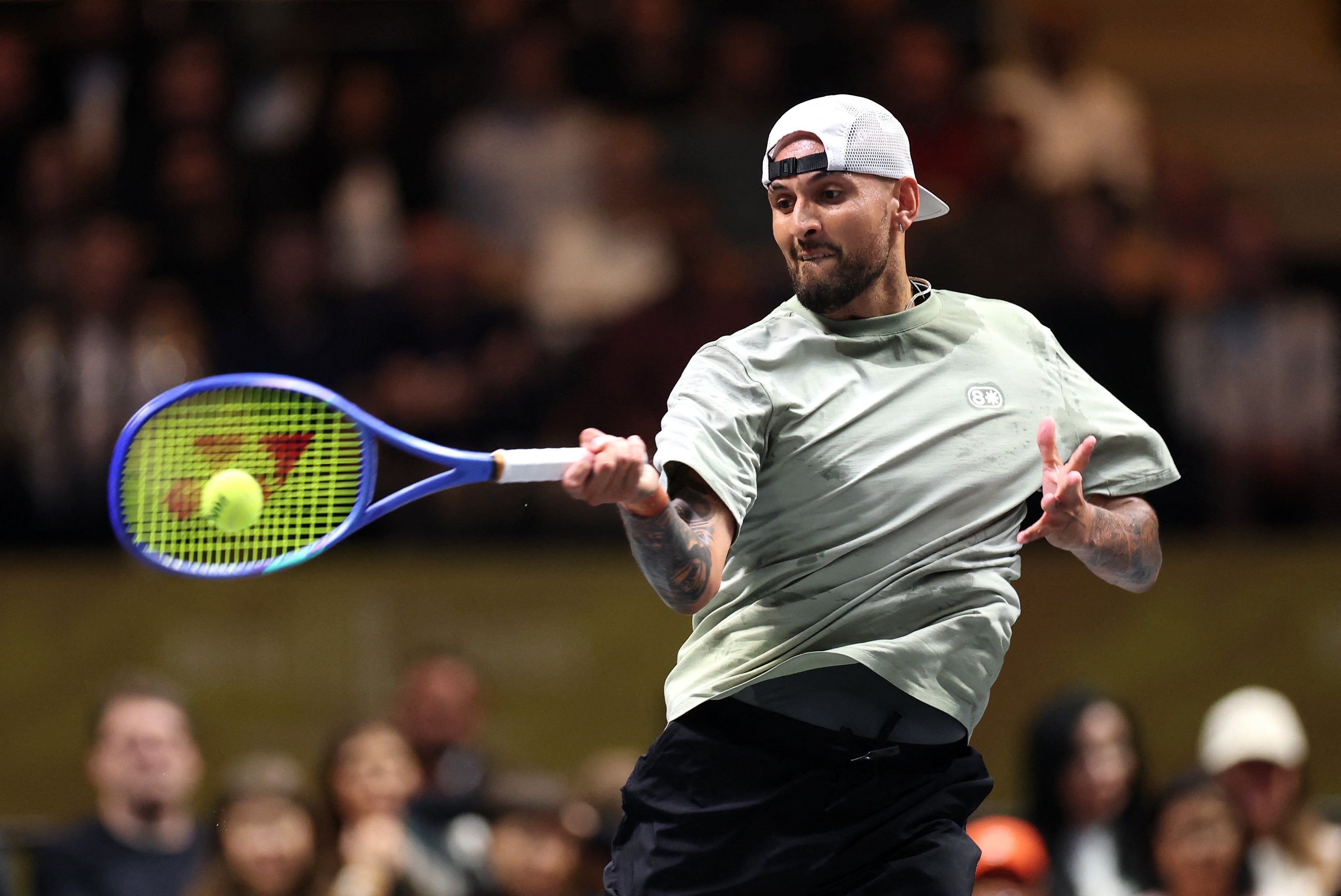 <p>Australia's Nick Kyrgios hits a return against Belarus' Aryna Sabalenka</p>