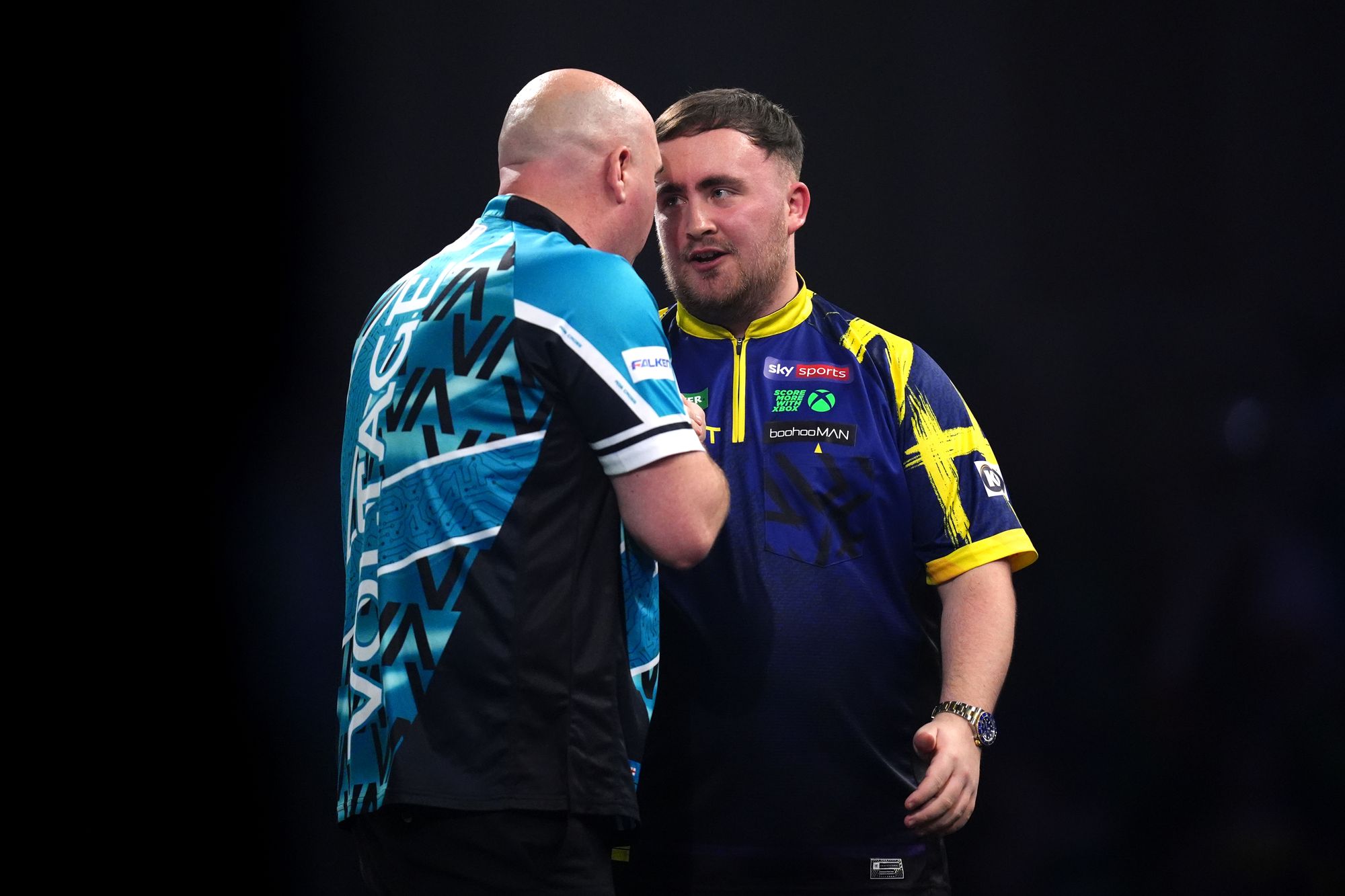 England's Luke Littler (right) celebrates defeating England's Rob Cross