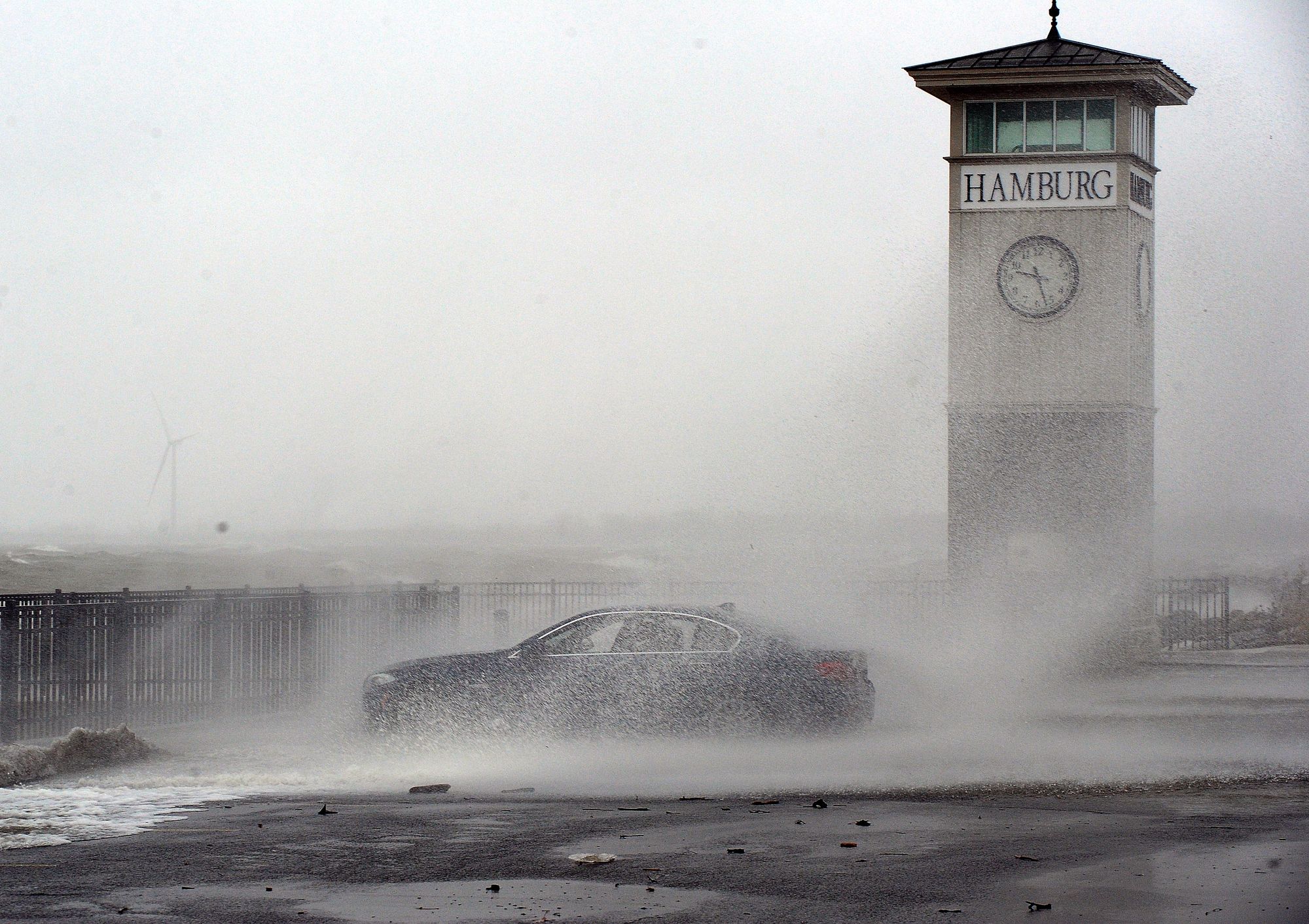 Waves are shown crashing against the pier in Hamburg, New York, on Monday
