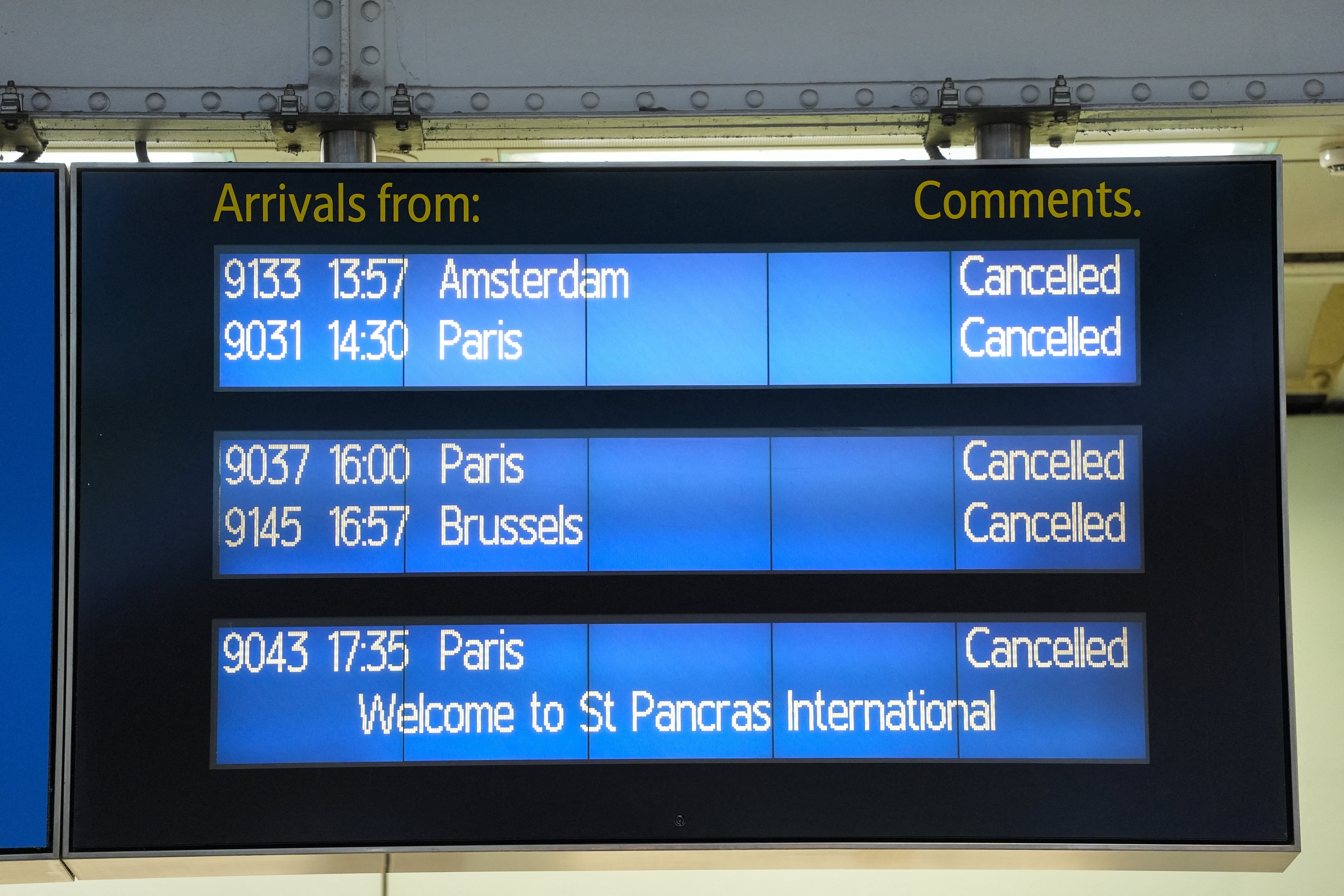 An arrivals board at St Pancras displays information on cancelled services