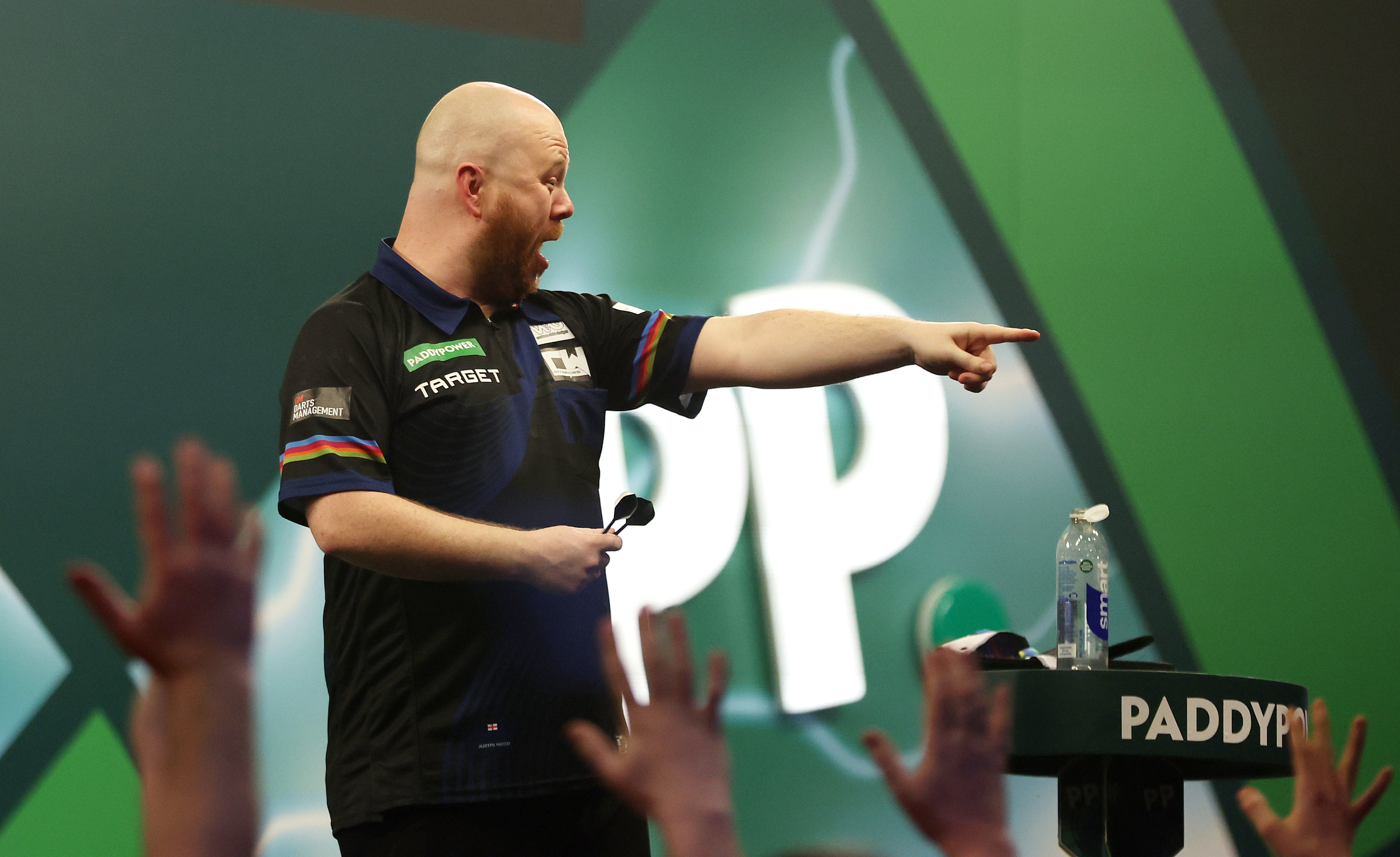 Justin Wood claimed a stunning win over Josh Rock at the PDC World Darts Championship
