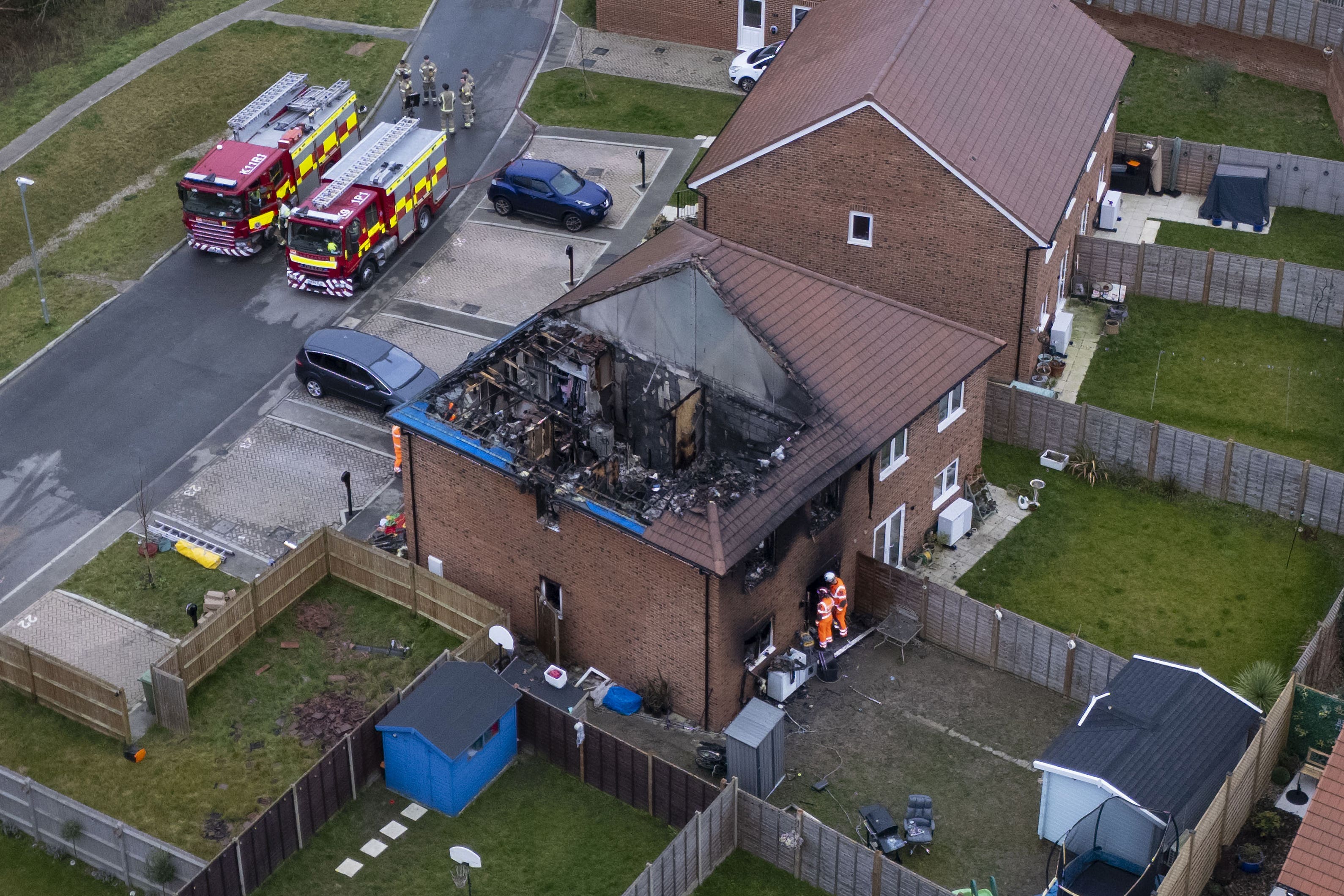 Emergency services at the scene in the village of Hamstreet, Kent, after a house fire (PA)