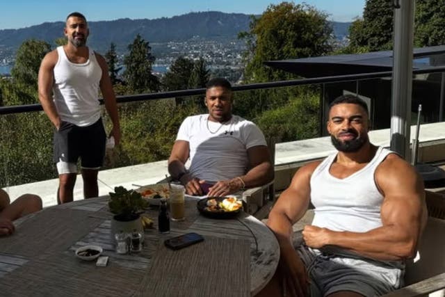 <p>Kevin ‘Lateef’ Ayodele (right) and Sina Ghami (left), who both died in the crash, are pictured alongside Anthony Joshua</p>