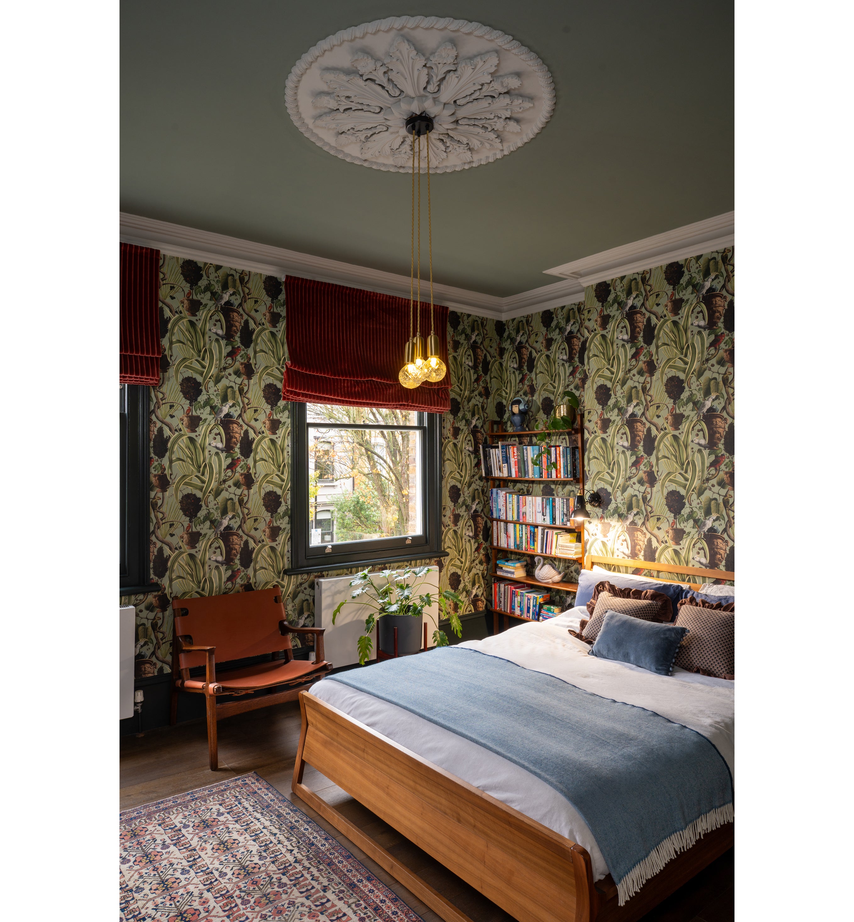 This character-filled bedroom blends historic detailing with richly layered pattern and texture