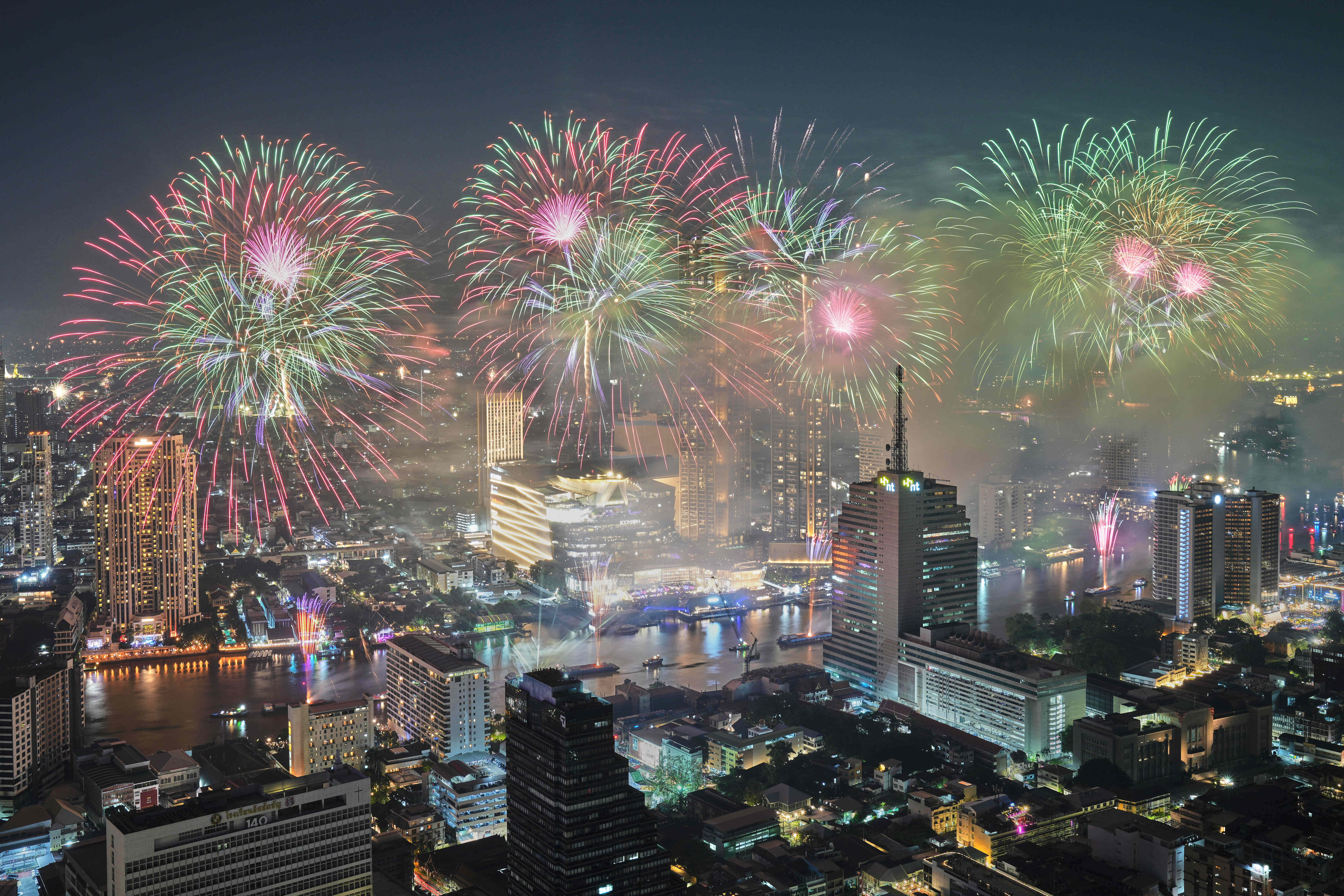 Fireworks explode over the Chao Phraya River during New Year celebrations in Bangkok, Thailand, Thursday, Jan. 1, 2026