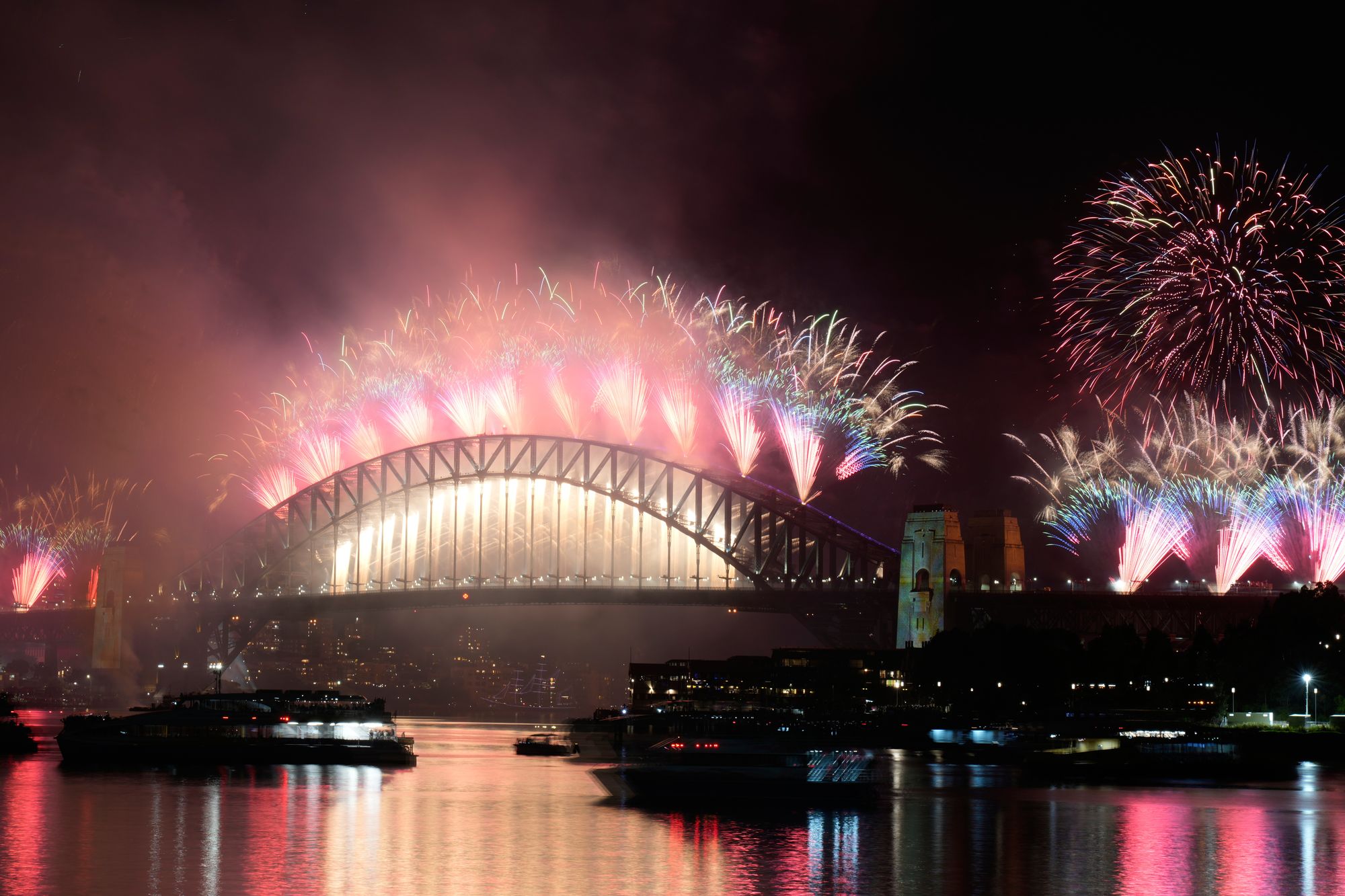 Fireworks burst over the Sydney Harbour Bridge during the New Year celebrations in Sydney