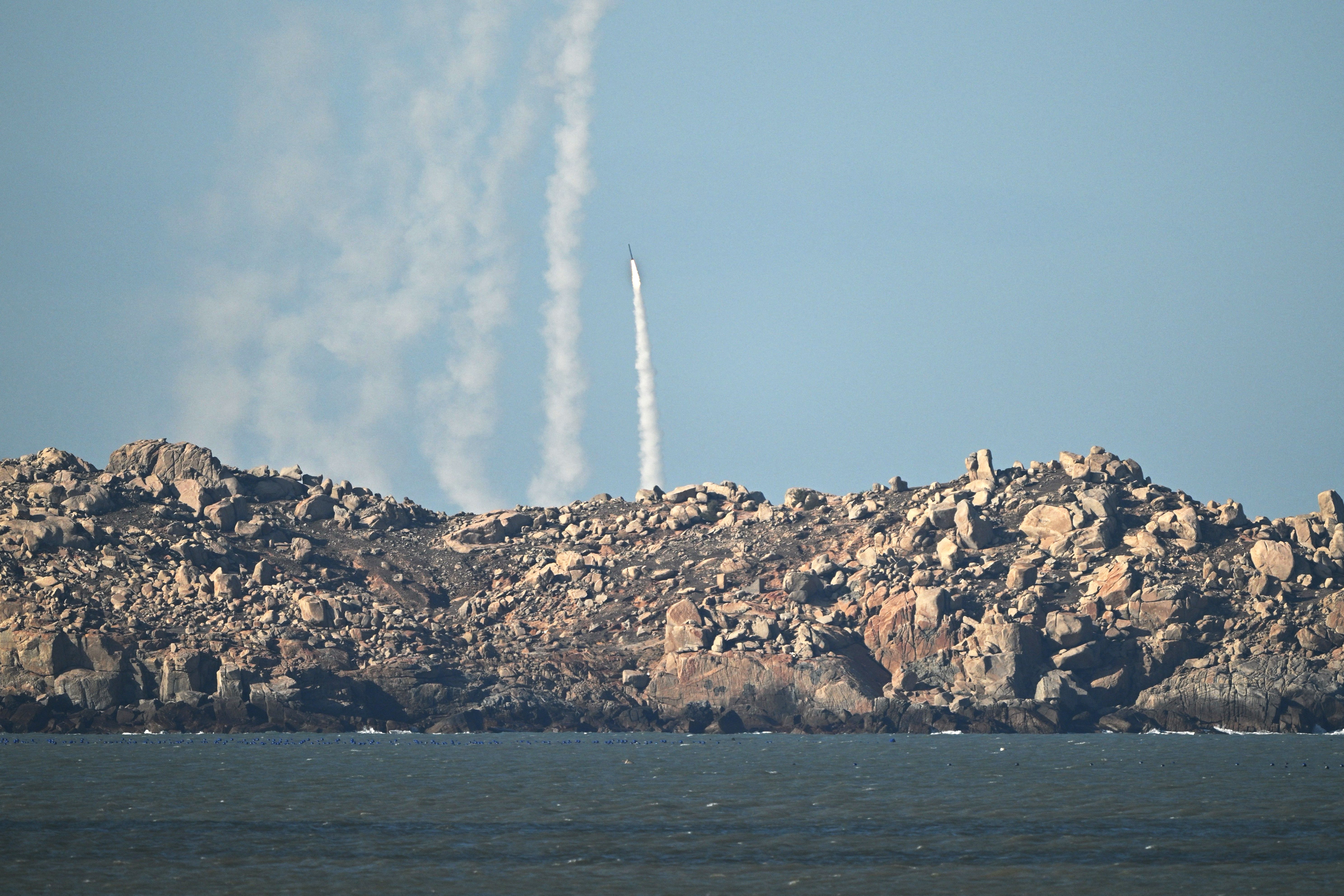 Chinese People's Liberation Army (PLA) soldiers fire a rocket into the air as they conduct military drills on Pingtan island, in eastern China's Fujian province, the closest point to Taiwan, on 30 December 2025