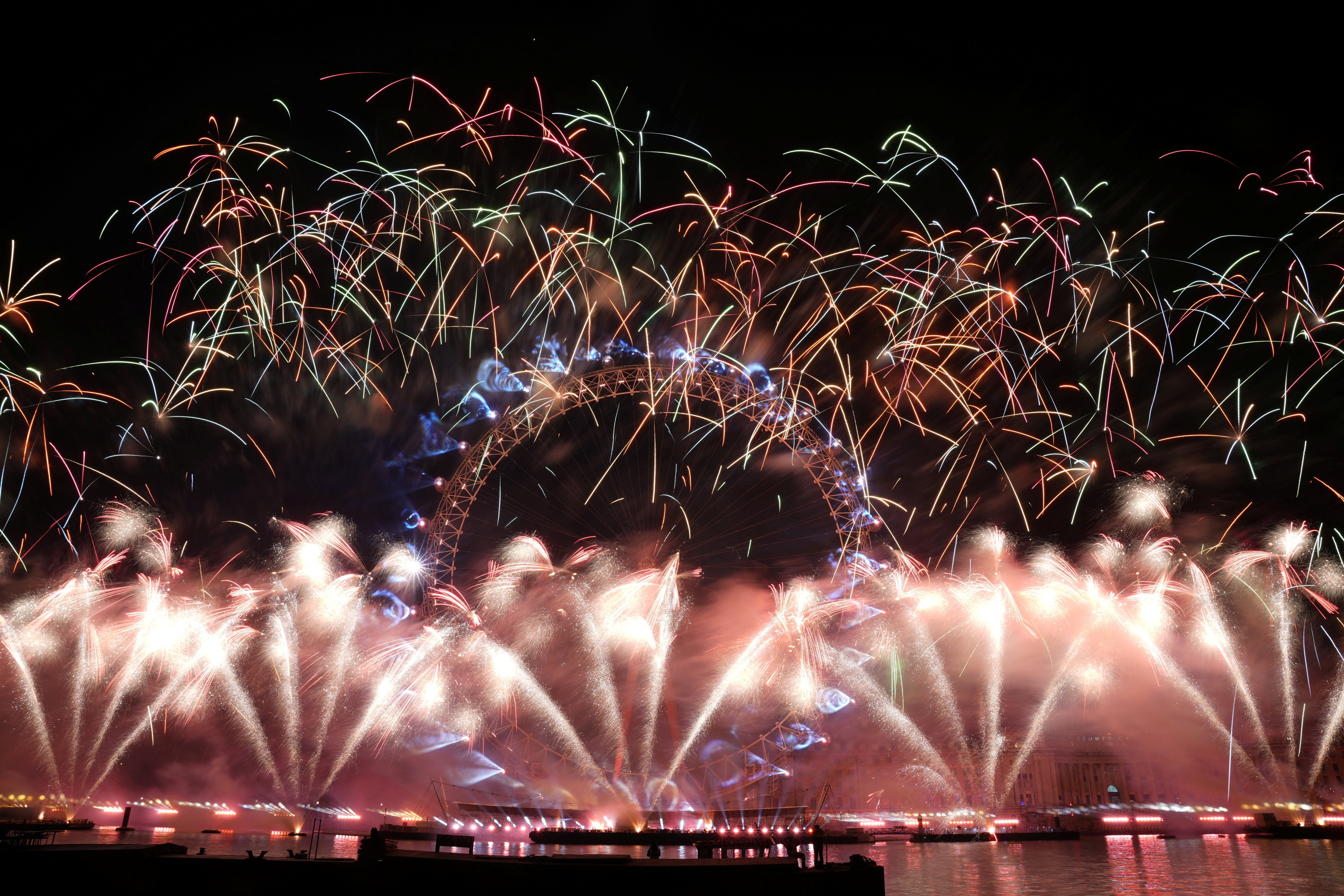 Fireworks explode over the London Eye Ferris wheel to mark the New Year's celebrations, in London, Britain, 1 January 2026