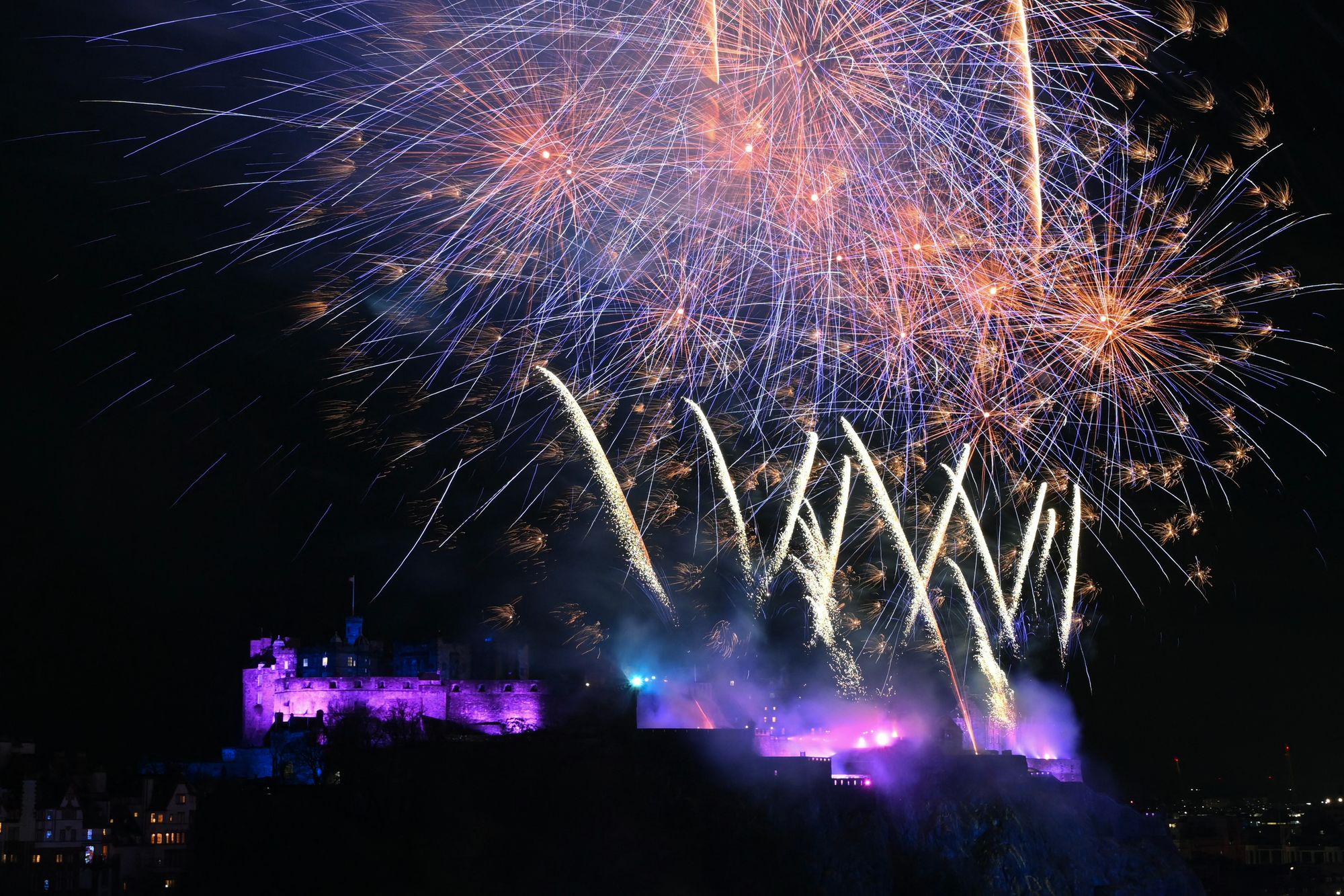 Fireworks explode in the sky over Edinburgh Castle to bring in the New Year in Edinburgh, at midnight on 1 January 2026