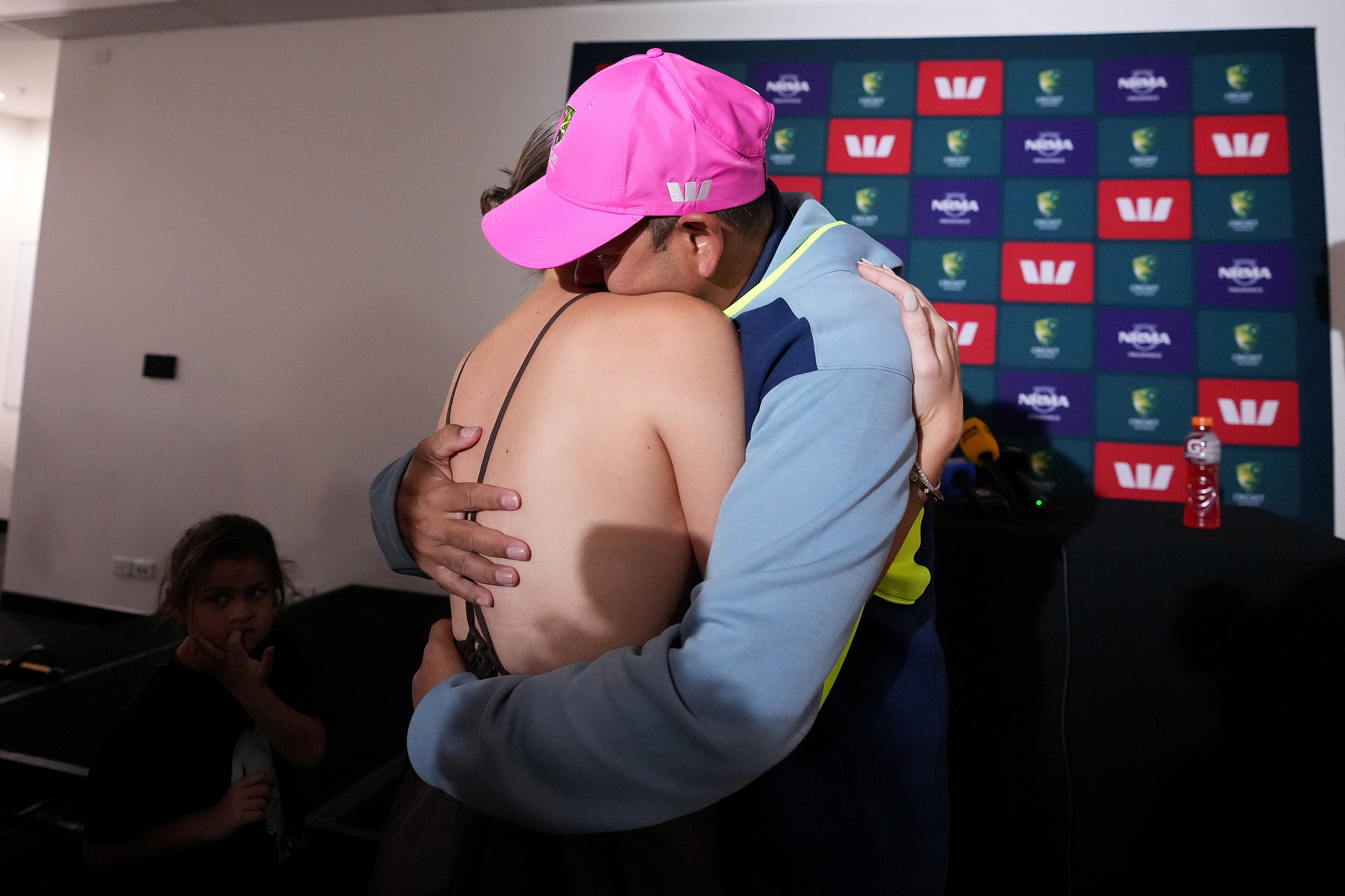 Australia’s Usman Khawaja (right) hugs his wife Rachel Khawaja (left) at a press conference to announce his retirement (Robbie Stephenson/PA)