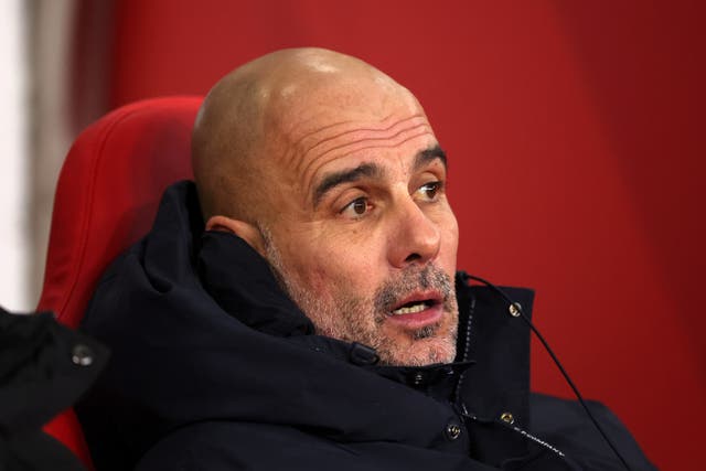 <p>Pep Guardiola, Manager of Manchester City, looks on from the team bench at Sunderland</p>