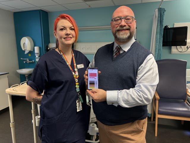 <p>Hazel McPhillips and Stephen Yorkstone , at Edinburgh Napier University, displaying a free online tool, called What Colour Is It?, which resembles a paint colour card</p>