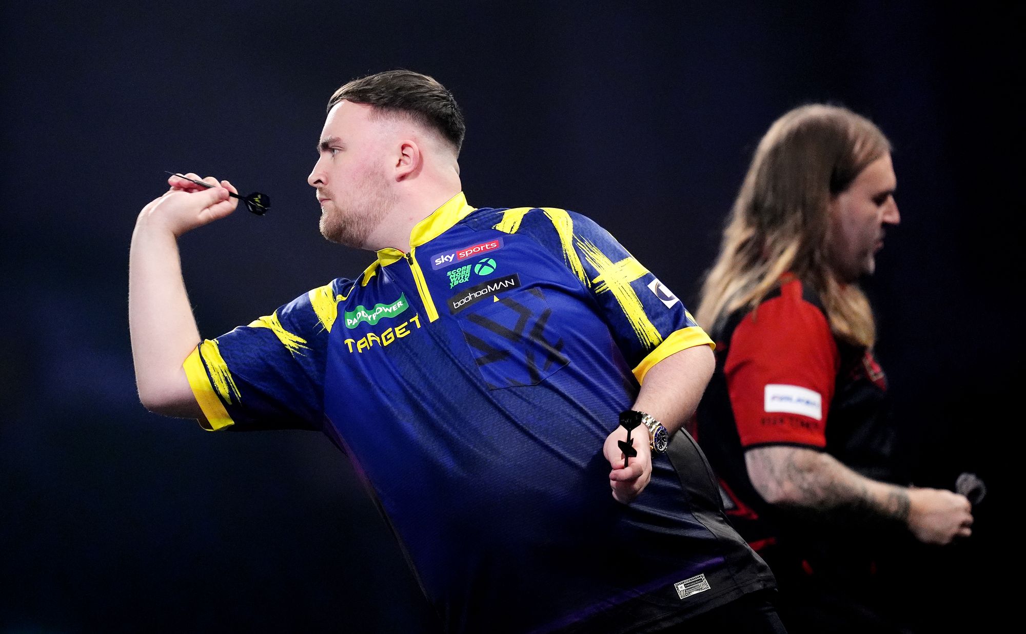 Luke Littler in action against Ryan Searle