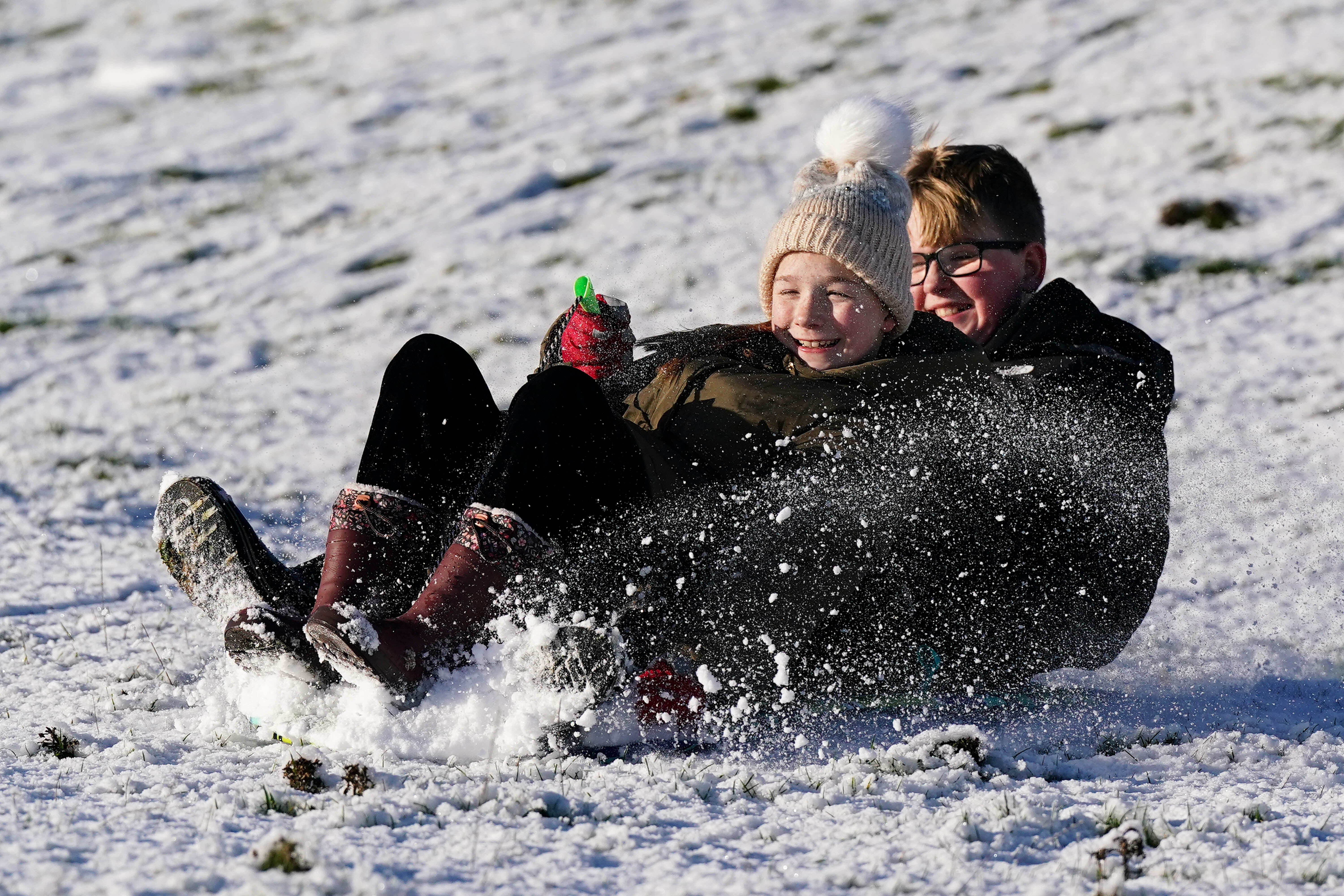 Parts of the UK will remain under snow and ice warnings until noon on Monday (Jacob King/PA)