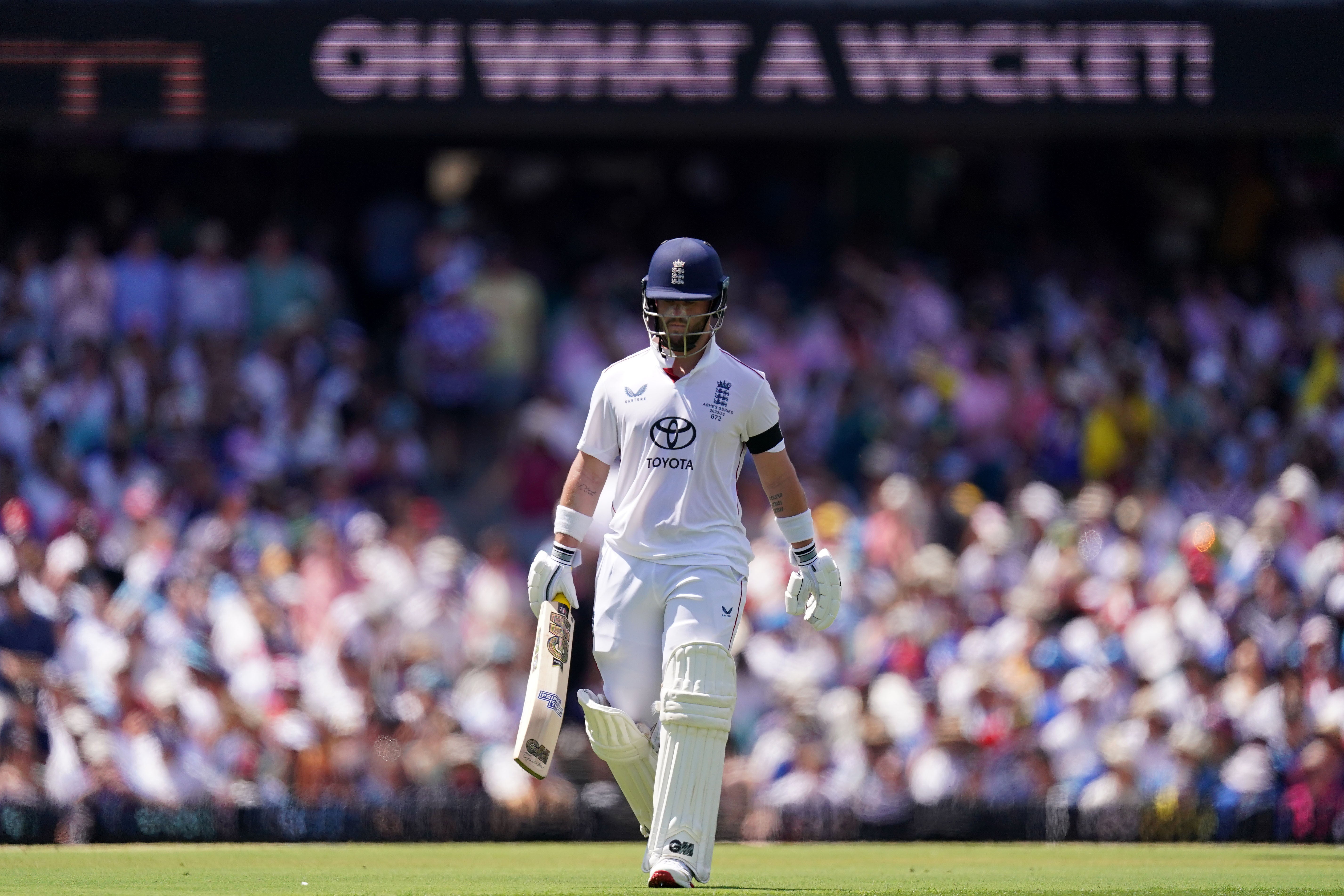 Ben Duckett walks off the ground after being dismissed by Mitchell Starc in Sydney (Robbie Stephenson/PA)