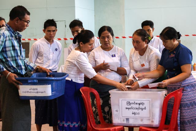 <p>Election Commission officials count ballots at a polling station during Myanmar’s general election in Yangon, 28 December 2025</p>