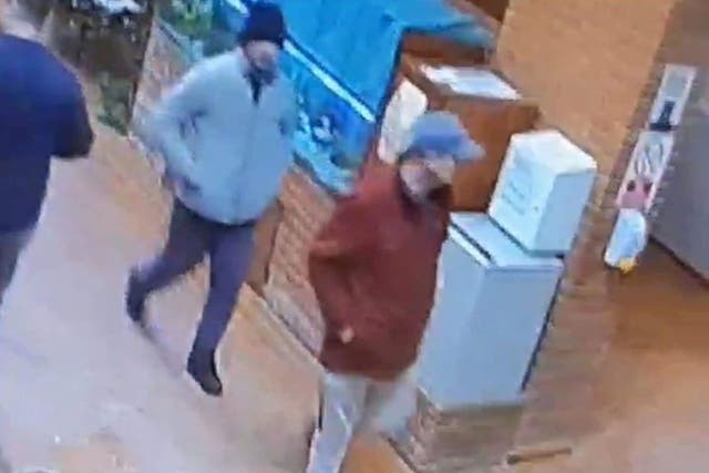 <p>CCTV image of Matthew Armstrong, 35, (front) and Daniel Washbourne, 40, who remain at large</p>