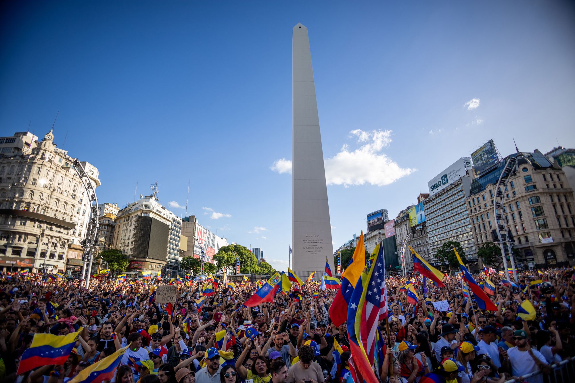 Venezuelans living in Argentina celebrate at the Obelisk in Buenos Aires on Saturday, after US forces captured Venezuelan leader Nicolas Maduro