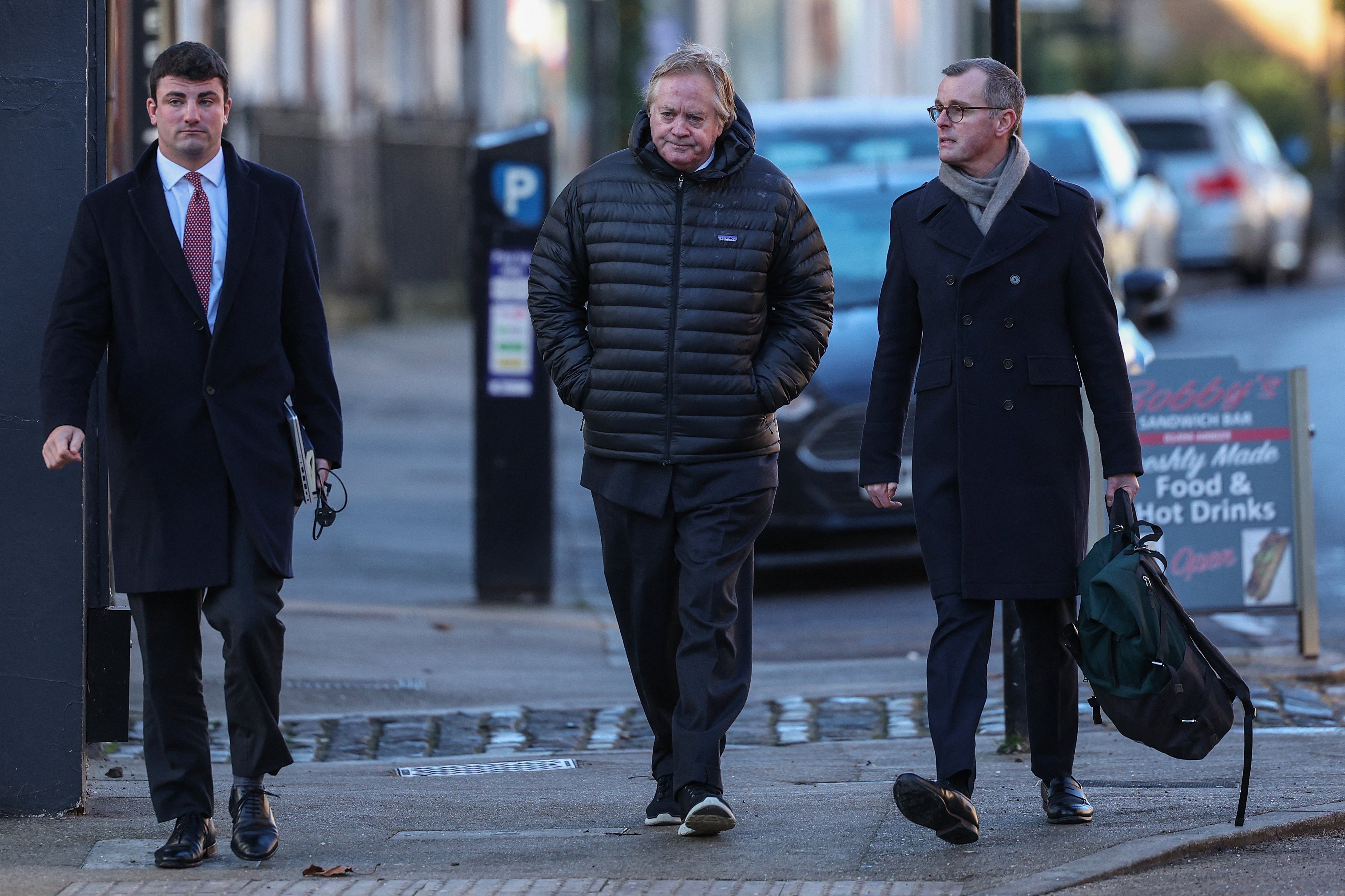 The Duke of Marlborough, pictured centre, pleaded not guilty to all three charges