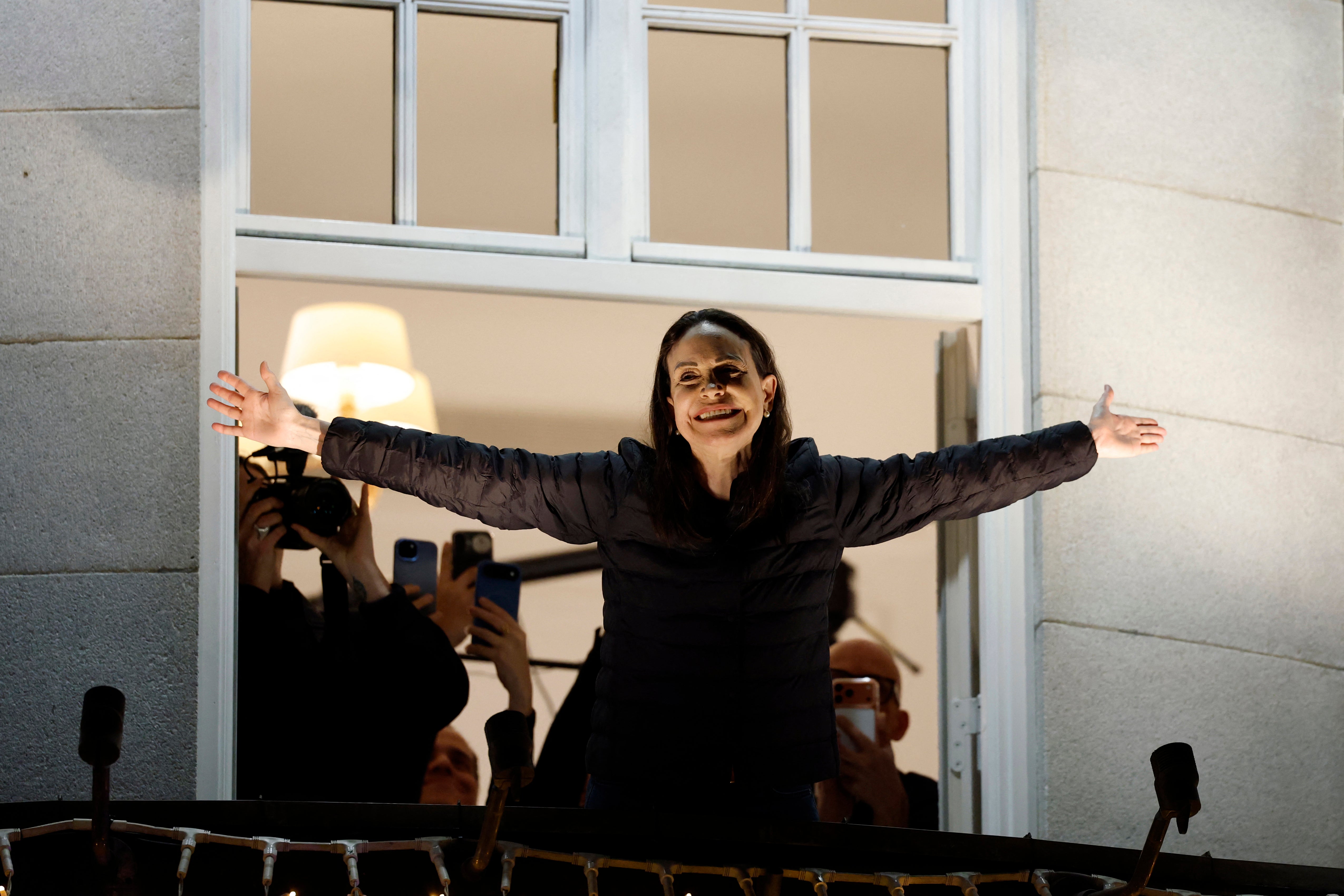 <p>Nobel peace laureate Maria Corina Machado greets supporters from a balcony of the Grand Hotel in Oslo</p>