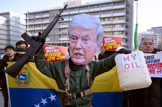 A protester wearing a mask of US President Donald Trump performs during a demonstration condemning the US attack on Venezuela and the seizure of Venezuelan leader Nicolas Maduro