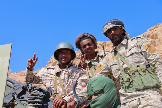 <p>Yemeni soldiers ride in the port city of Mukalla after retaking it from southern separatists</p>