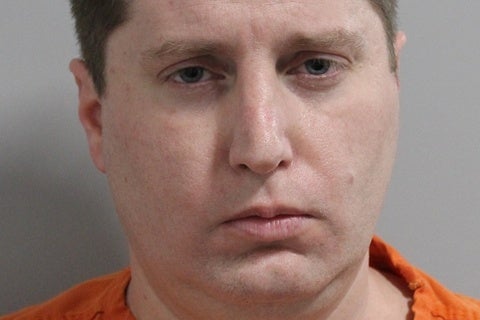 <p>Matthew Zaccarino in a police mugshot from Polk County, Florida, after being accused of armed trespassing while dressed only in a bra and G-string</p>