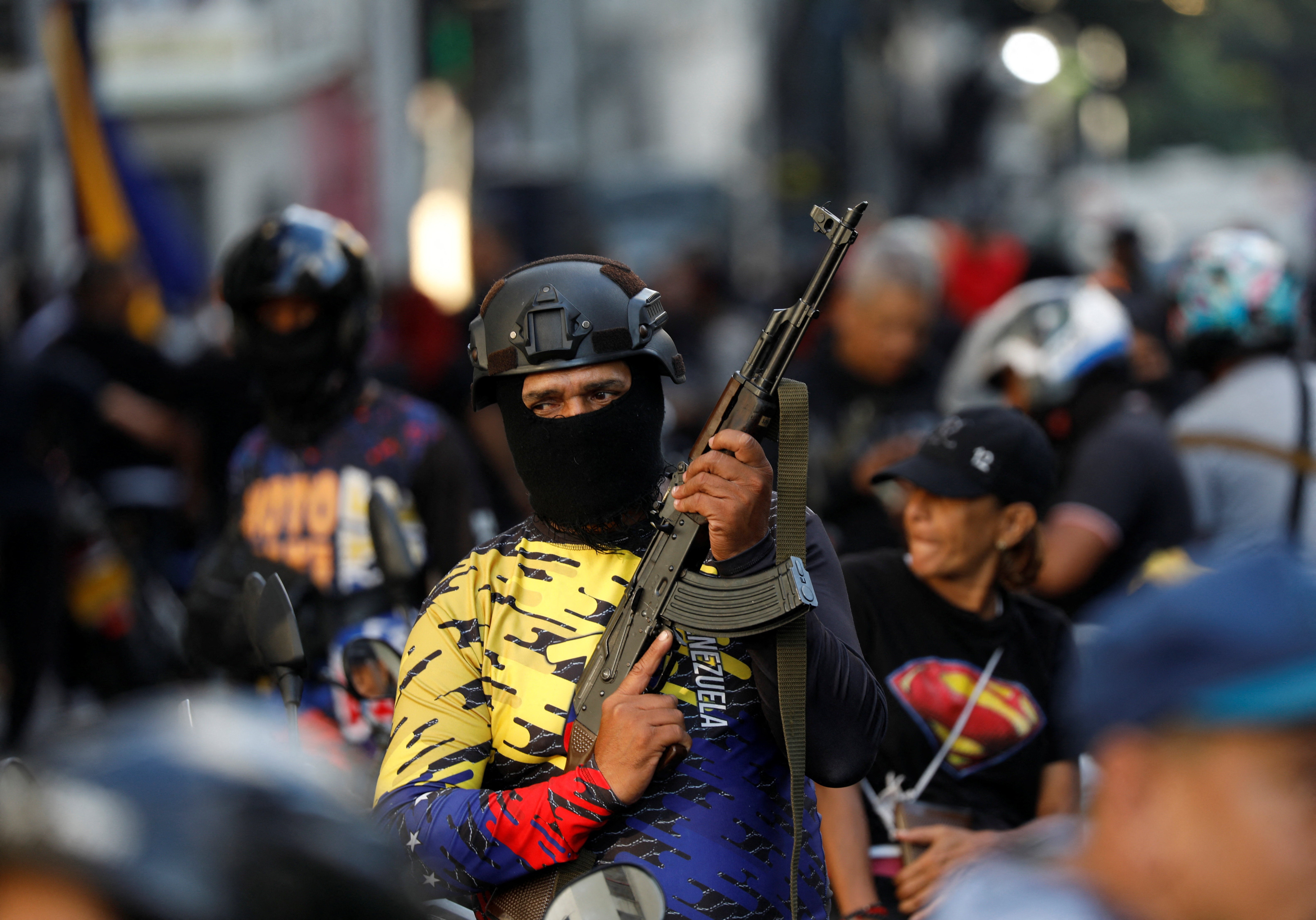 A member of the militia group known as ‘Colectivos’ at a march calling for the release of Venezuela's President Nicolas Maduro