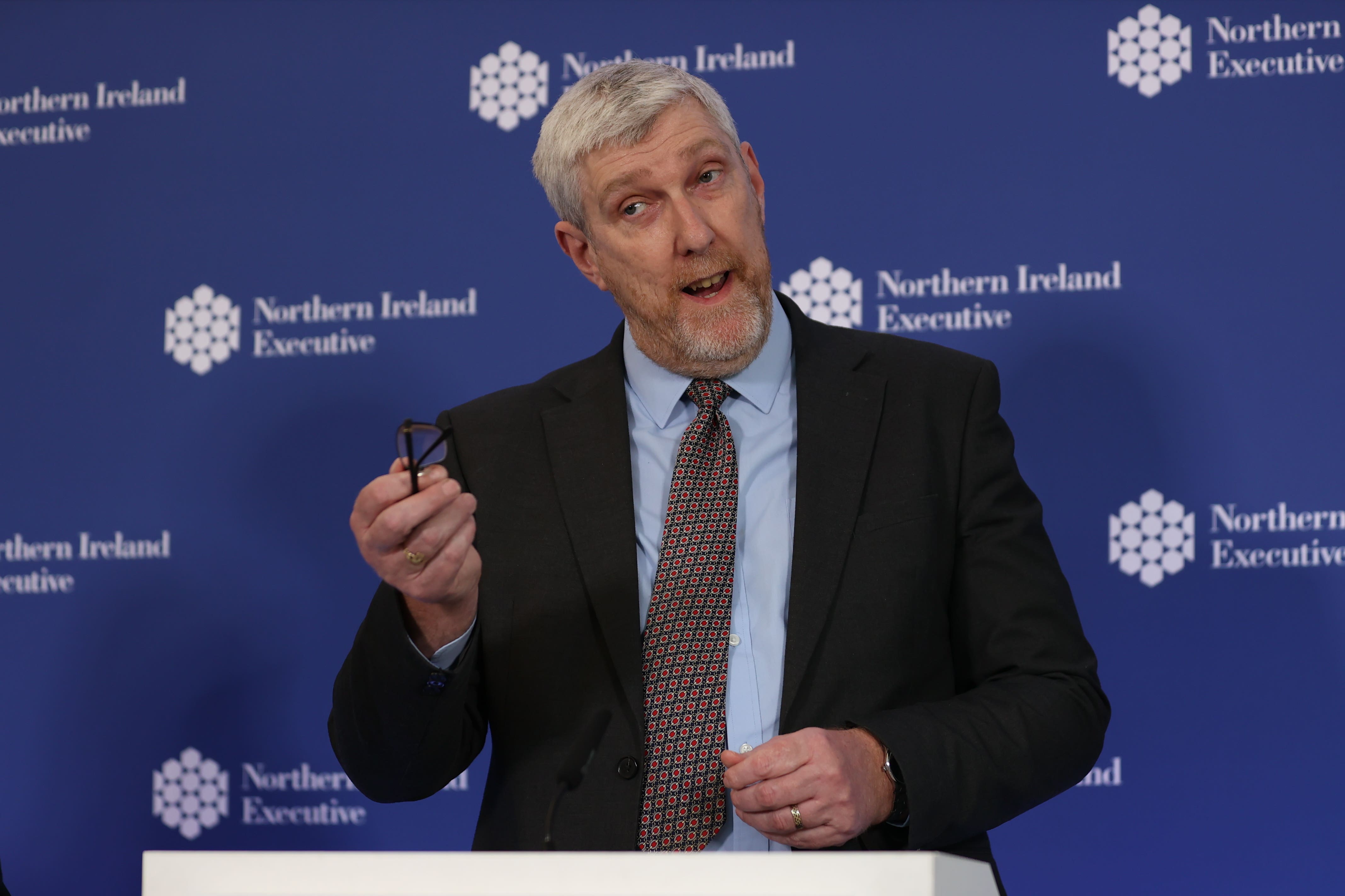 Finance Minister John O’Dowd speaking to media at Parliament Buildings in Stormont (Liam McBurney/PA)