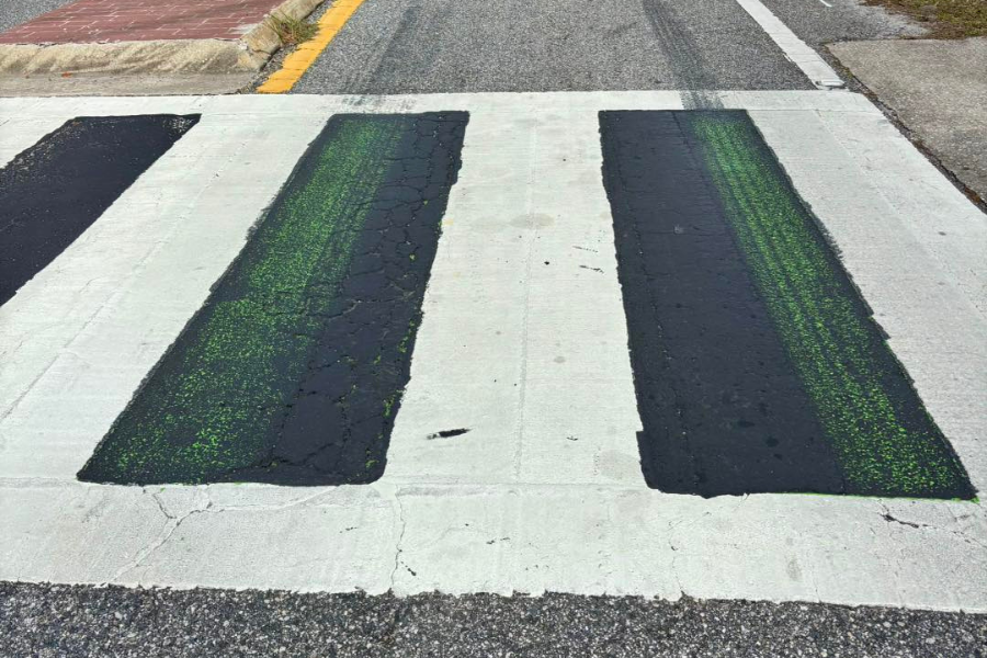 <p>Oviedo Mayor Megan Sladek shared a photo Monday showing green crosswalk paint peeking through the black overlay</p>