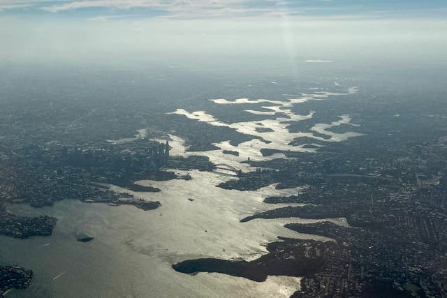 <p>File. Smoke rises from bushfires on the outskirts of Sydney on 8 December 2025</p>