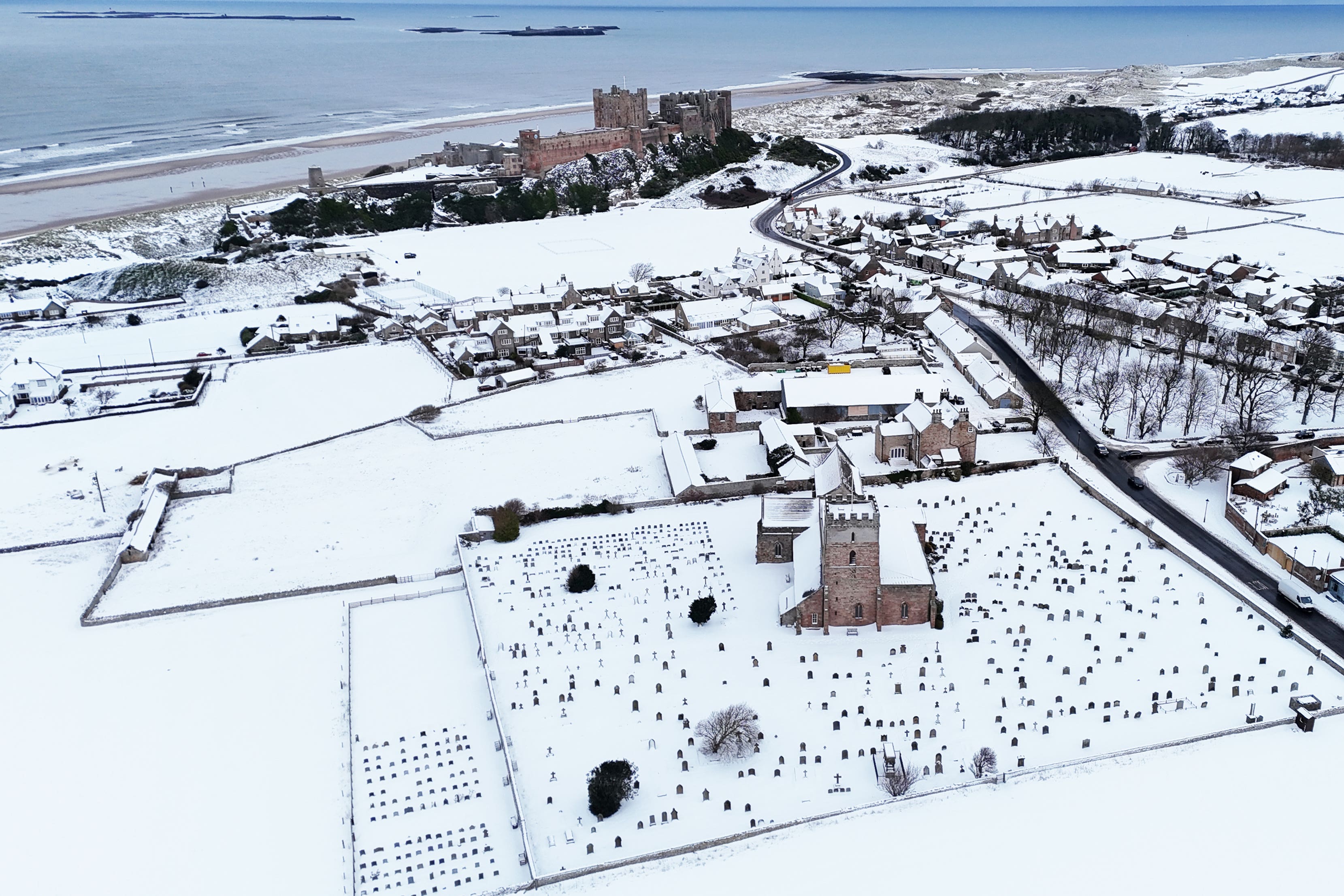 Bamburgh Castle surrounded by snow in Bamburgh, Northumberland (Owen Humphreys/PA)